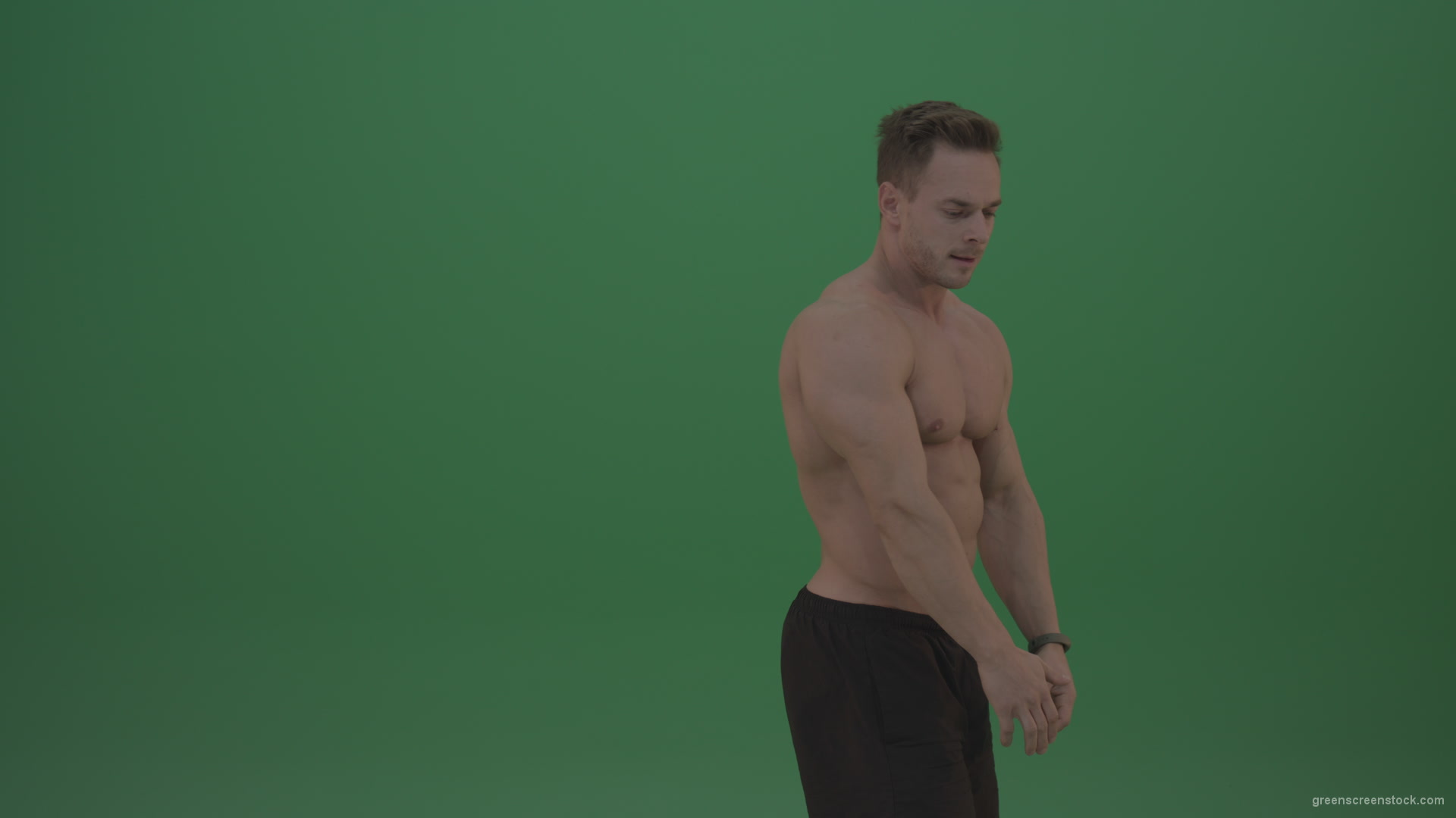 Green-Screen-Blone_Bodybuilder_Demonstrating_Front_Double_Biceps_And_Lateral_Spread_Positions_On_Green_Screen_Wall_Background_007 Green Screen Stock