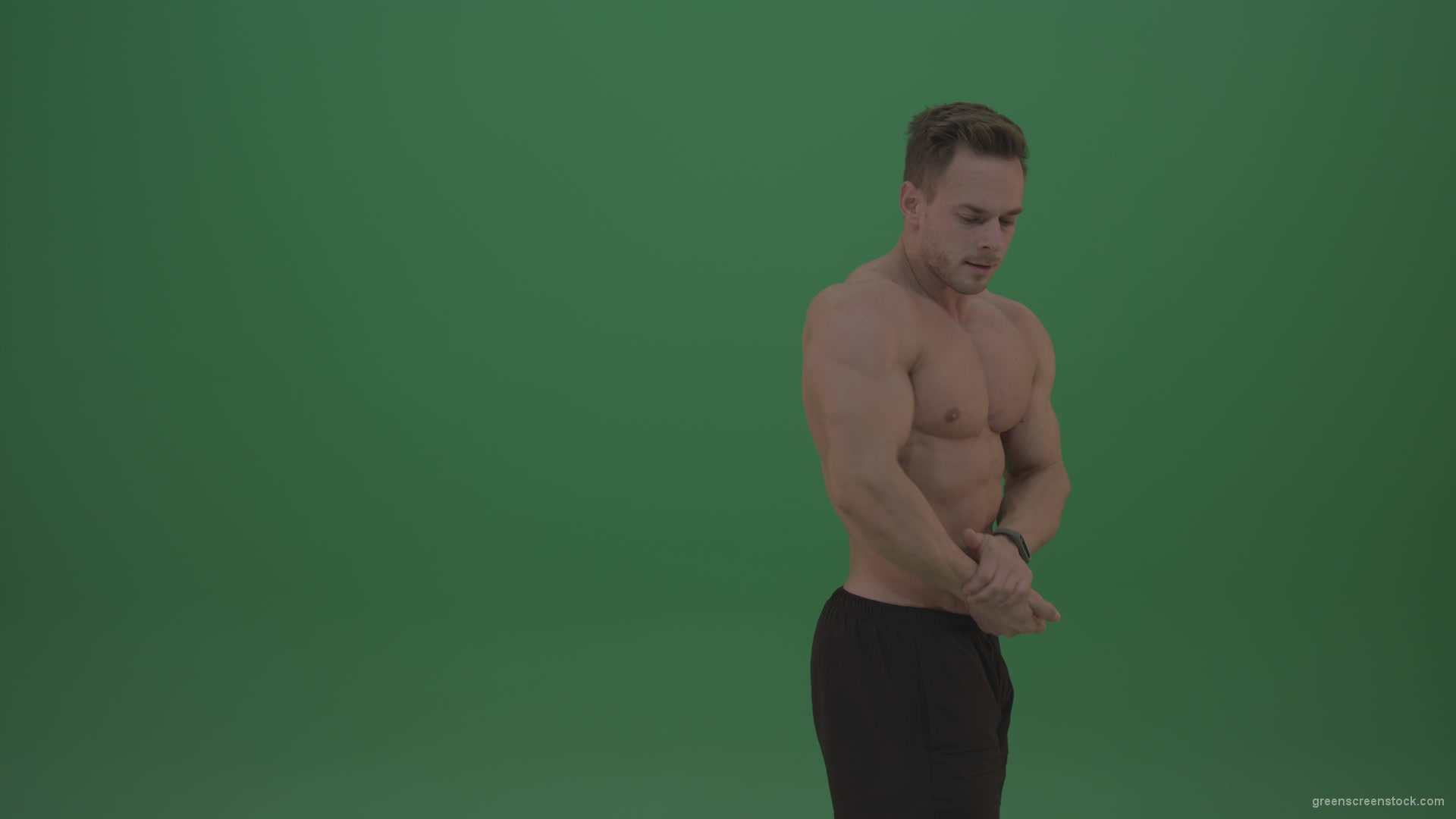 Green-Screen-Blone_Bodybuilder_Demonstrating_Front_Double_Biceps_And_Lateral_Spread_Positions_On_Green_Screen_Wall_Background_008 Green Screen Stock