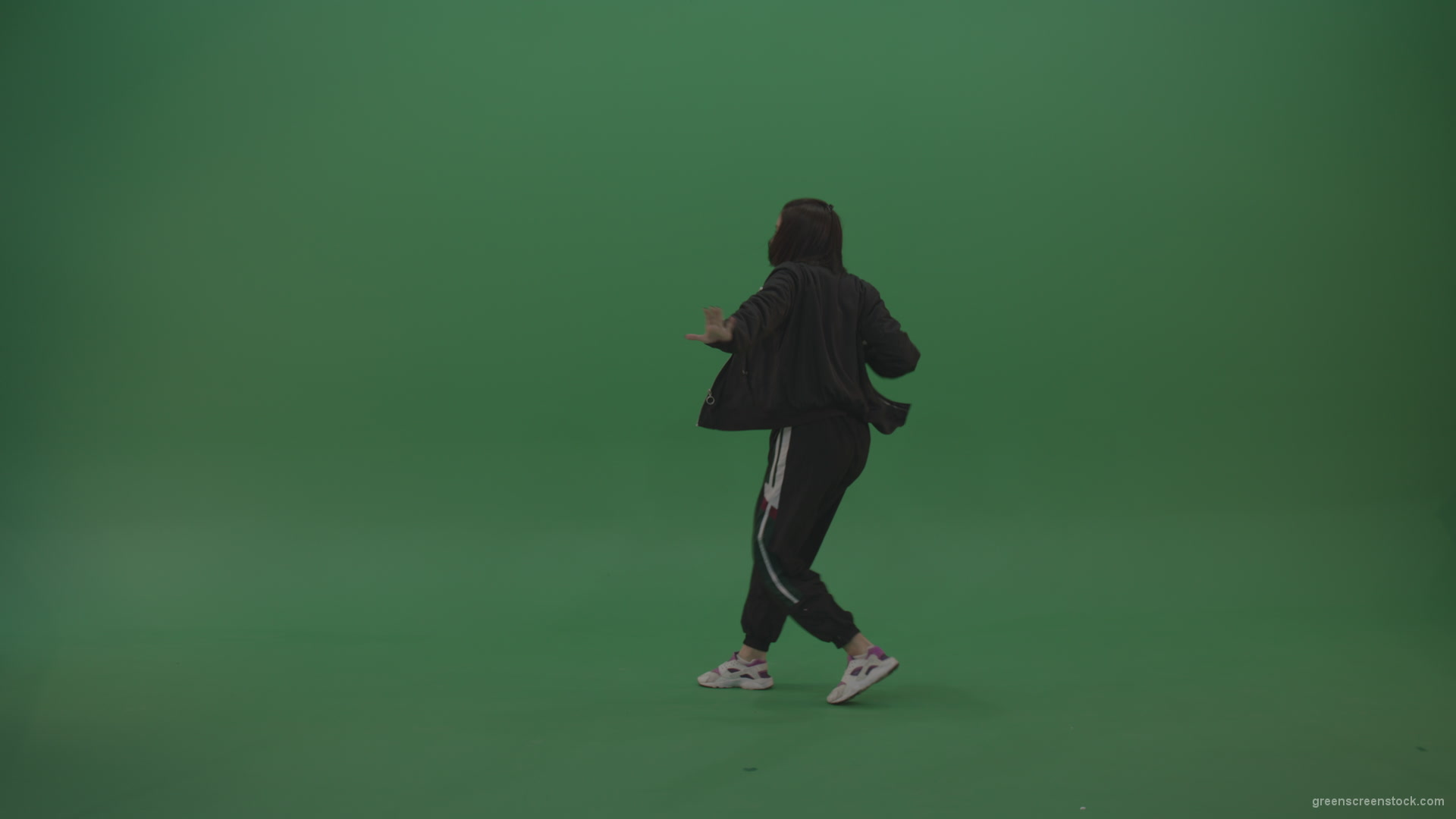 Incredible_Dance_Hip_Hop_Moves_From_Young_Brunette_Female_Wearing_Black_Sweat_Suite_And_White_Trainers_On_Green_Screen_Wall_Background_001 Green Screen Stock