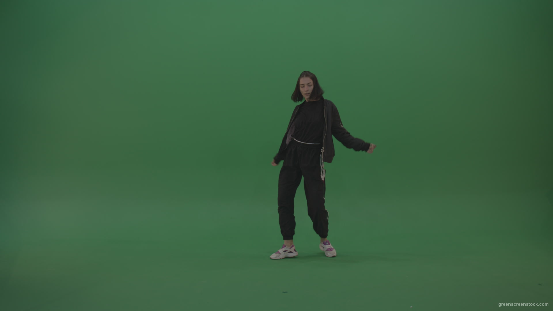 Incredible_Dance_Hip_Hop_Moves_From_Young_Brunette_Female_Wearing_Black_Sweat_Suite_And_White_Trainers_On_Green_Screen_Wall_Background_004 Green Screen Stock