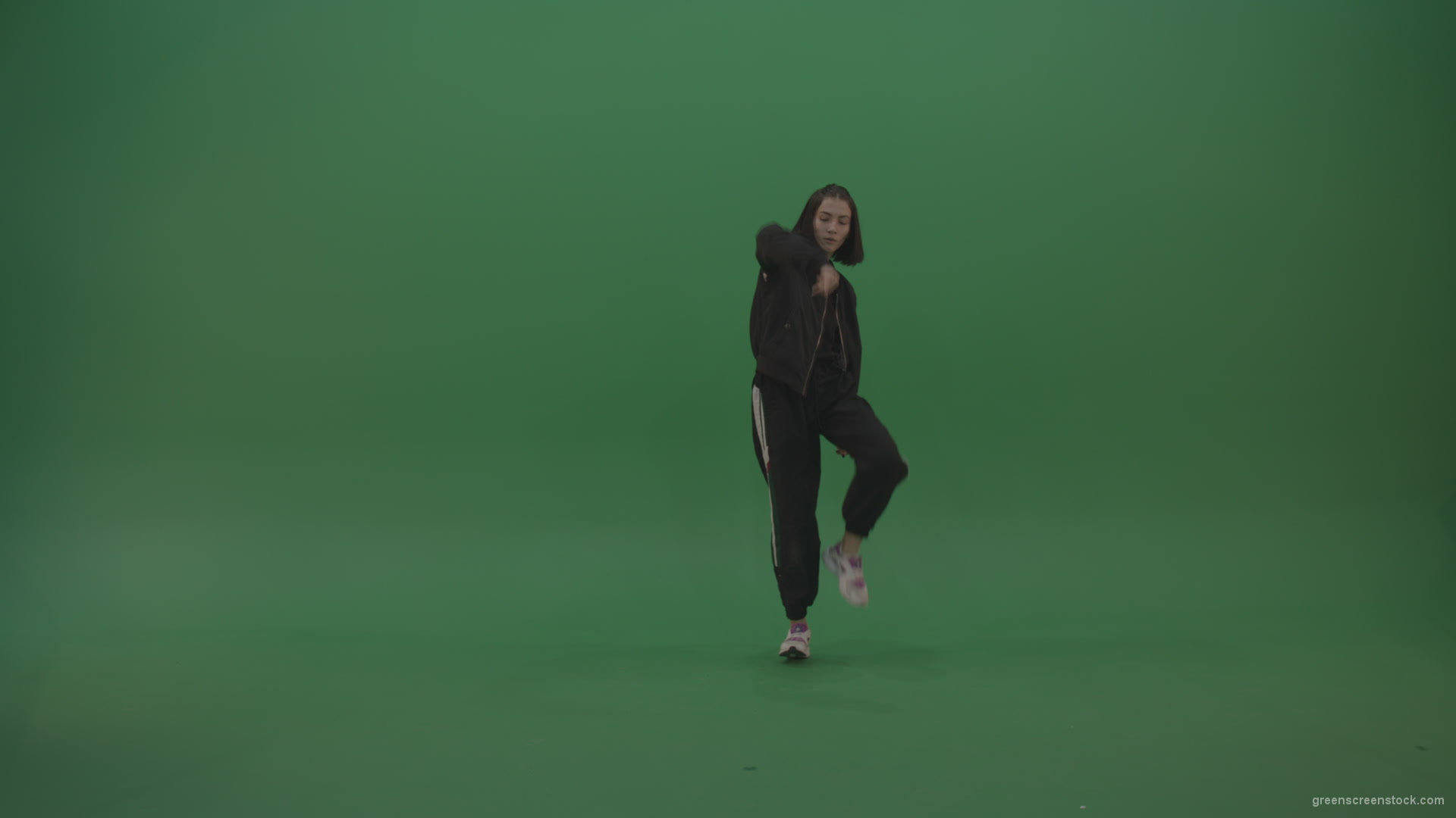 Incredible_Dance_Hip_Hop_Moves_From_Young_Brunette_Female_Wearing_Black_Sweat_Suite_And_White_Trainers_On_Green_Screen_Wall_Background_005 Green Screen Stock
