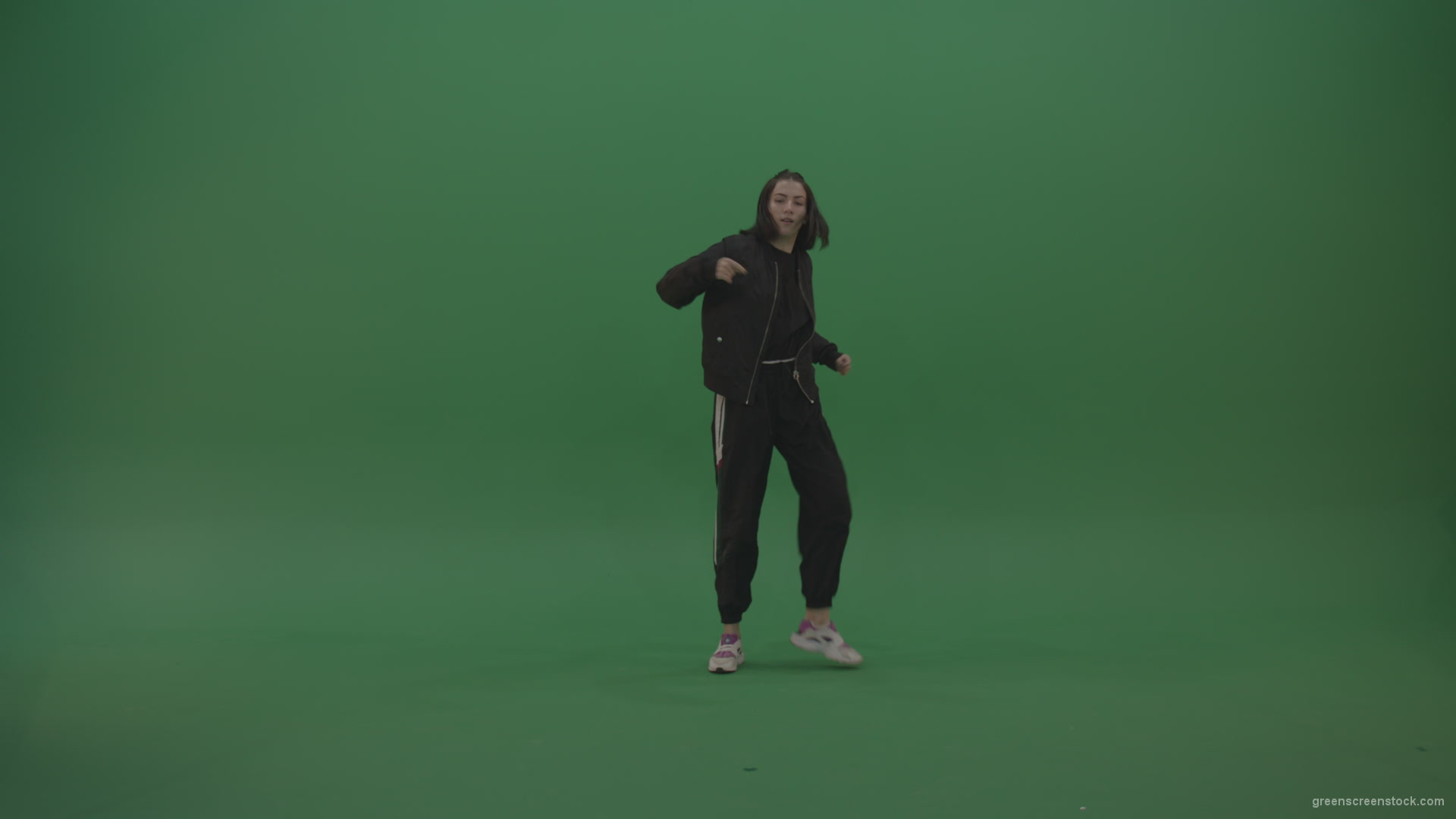 Incredible_Dance_Hip_Hop_Moves_From_Young_Brunette_Female_Wearing_Black_Sweat_Suite_And_White_Trainers_On_Green_Screen_Wall_Background_006 Green Screen Stock