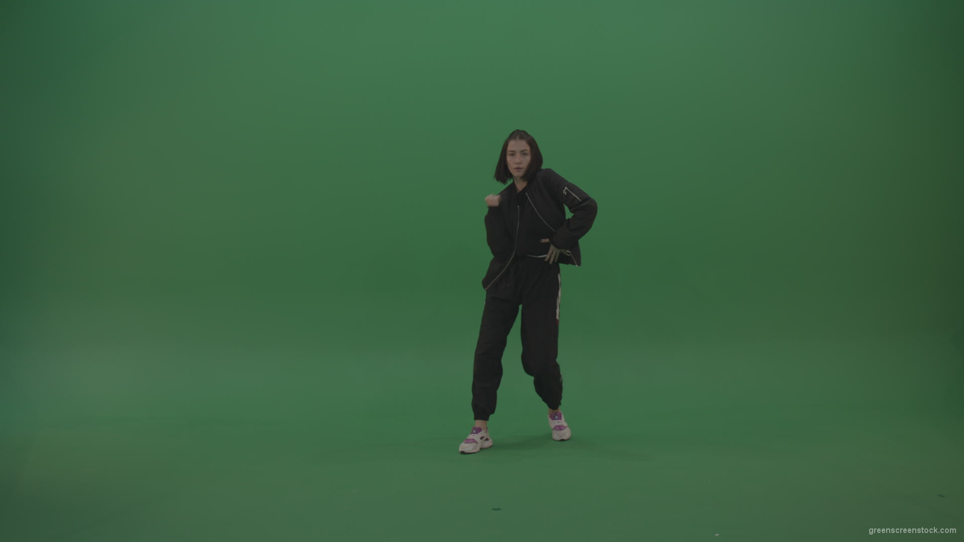 Incredible_Dance_Hip_Hop_Moves_From_Young_Brunette_Female_Wearing_Black_Sweat_Suite_And_White_Trainers_On_Green_Screen_Wall_Background_007 Green Screen Stock