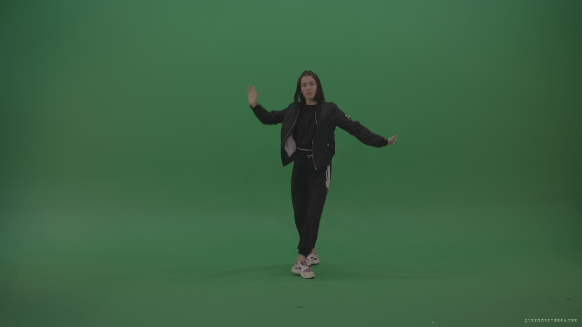 Incredible_Dance_Hip_Hop_Moves_From_Young_Brunette_Female_Wearing_Black_Sweat_Suite_And_White_Trainers_On_Green_Screen_Wall_Background_008 Green Screen Stock