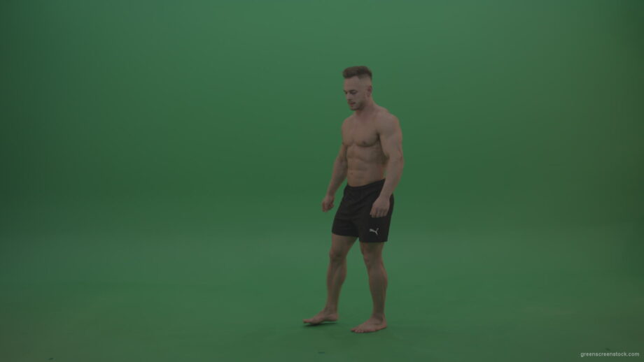 vj video background Young_Athletic_Bodybuilder_Demonstrating_Front_Double_Biceps_And_Lateral_Spread_Positions_On_Green_Screen_Wall_Background_003
