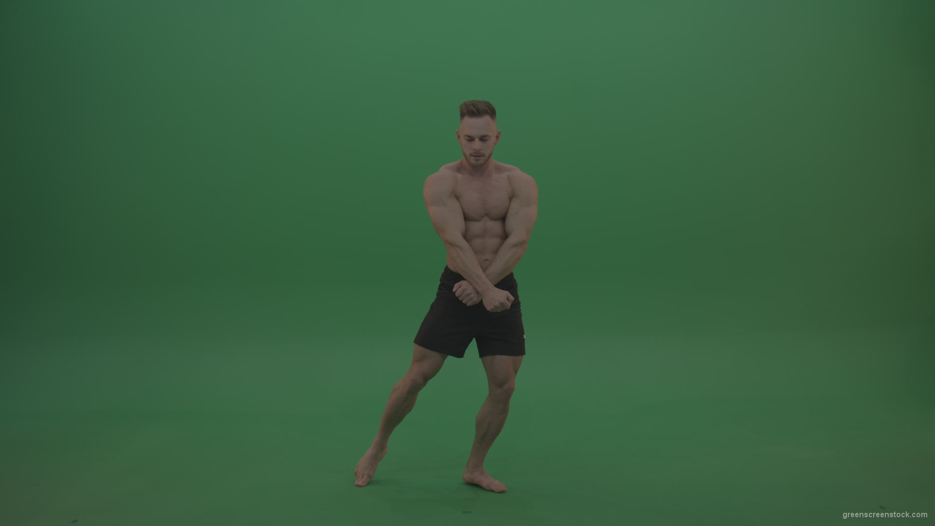 Young_Athletic_Bodybuilder_Demonstrating_Front_Double_Biceps_And_Lateral_Spread_Positions_On_Green_Screen_Wall_Background_004 Green Screen Stock