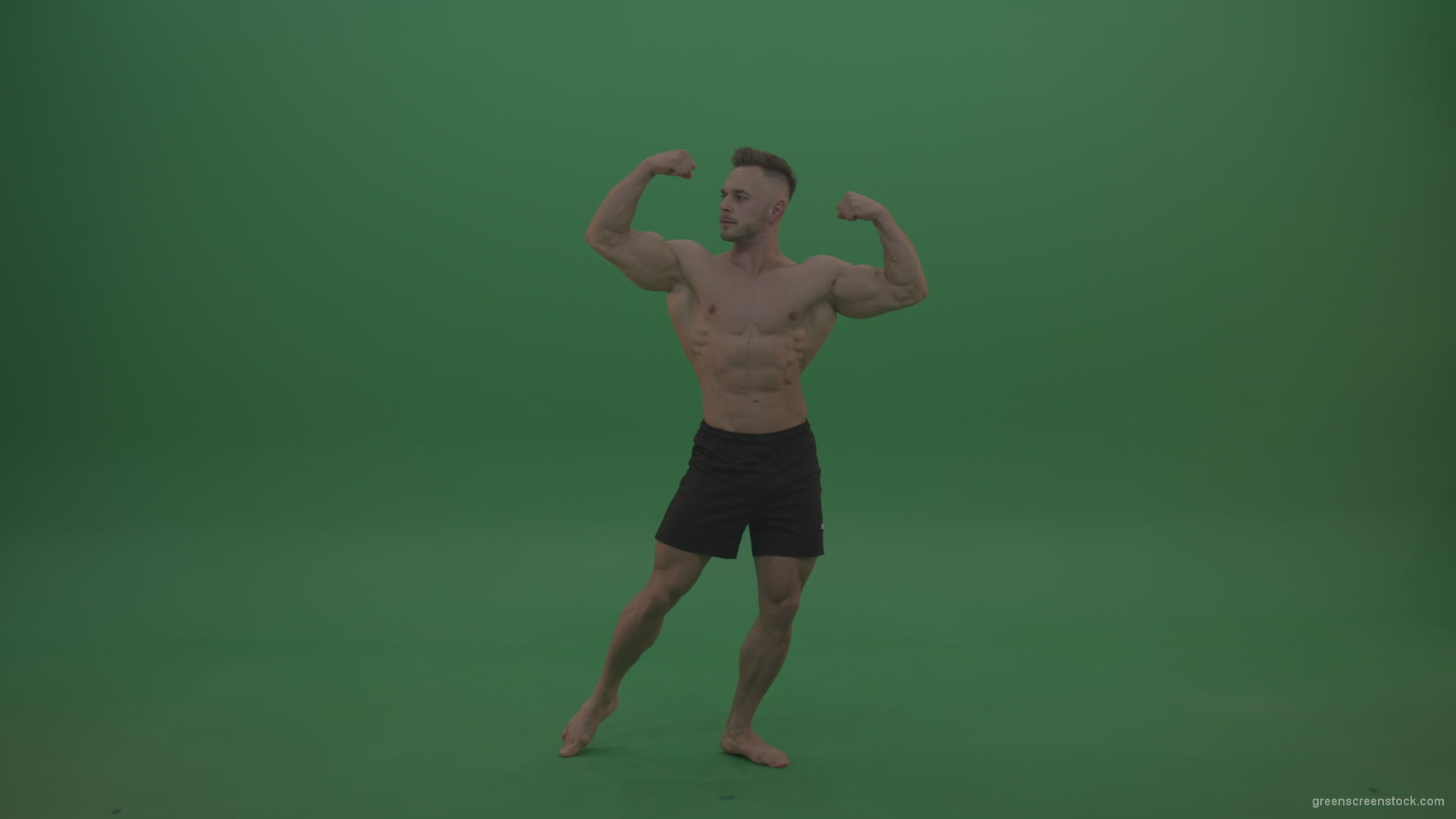 Young_Athletic_Bodybuilder_Demonstrating_Front_Double_Biceps_And_Lateral_Spread_Positions_On_Green_Screen_Wall_Background_005 Green Screen Stock