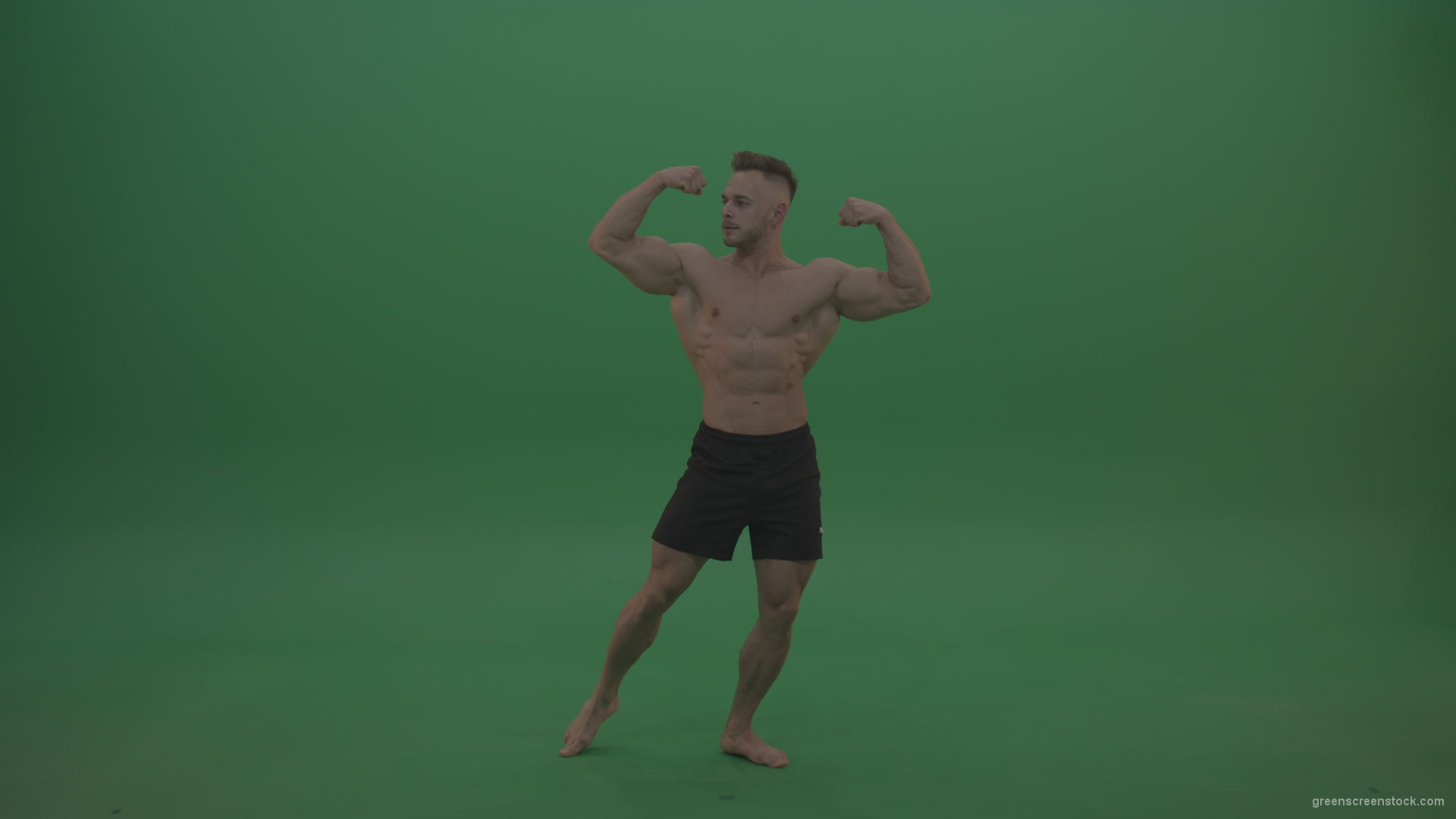 Young_Athletic_Bodybuilder_Demonstrating_Front_Double_Biceps_And_Lateral_Spread_Positions_On_Green_Screen_Wall_Background_006 Green Screen Stock