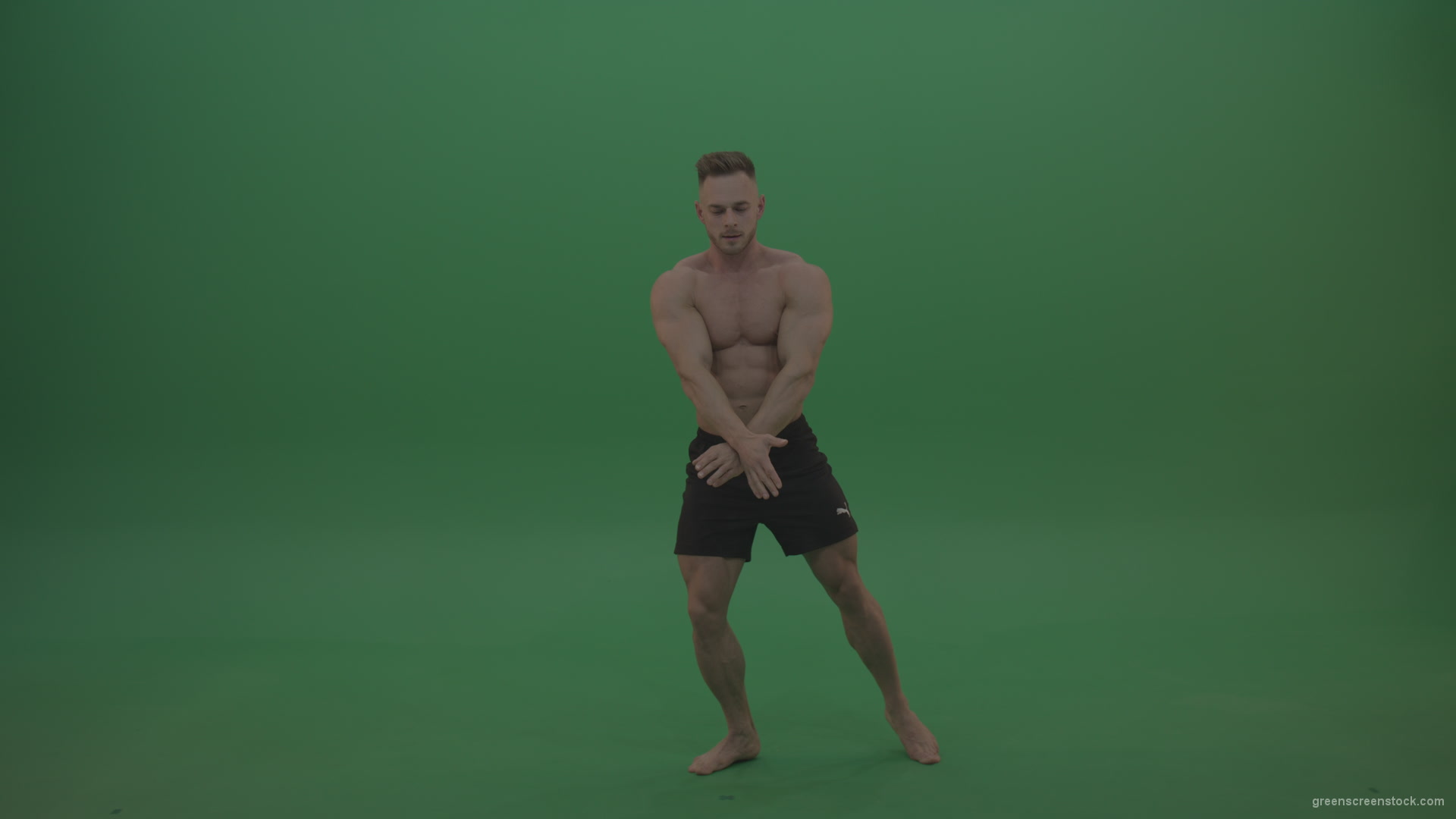 Young_Athletic_Bodybuilder_Demonstrating_Front_Double_Biceps_And_Lateral_Spread_Positions_On_Green_Screen_Wall_Background_007 Green Screen Stock