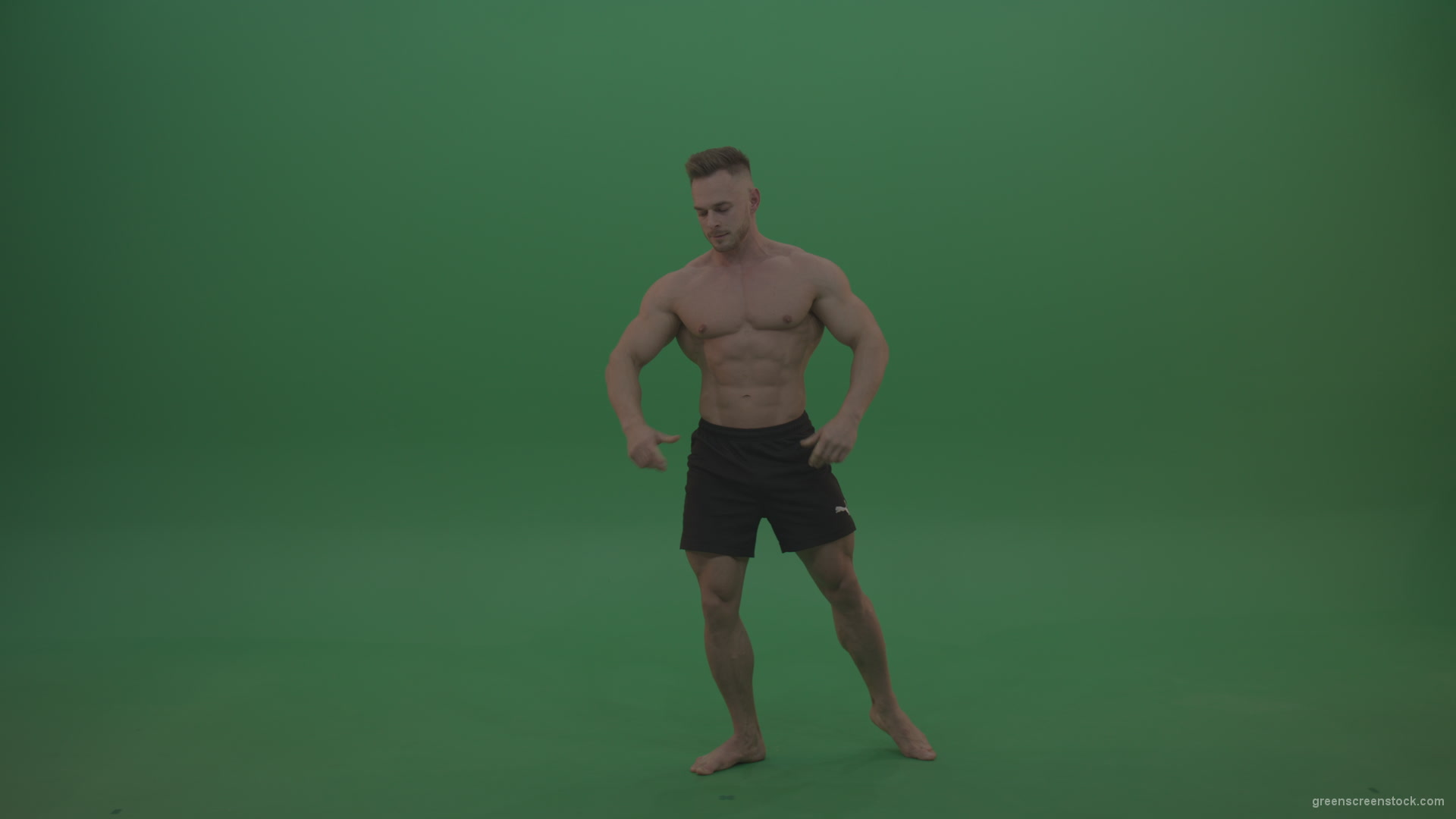 Young_Athletic_Bodybuilder_Demonstrating_Front_Double_Biceps_And_Lateral_Spread_Positions_On_Green_Screen_Wall_Background_009 Green Screen Stock