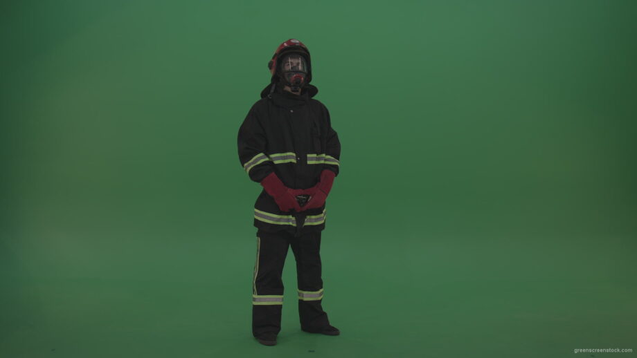 vj video background Young_Firefighter_Wearing_Full_FIreman_Working_Kit_Looking_Around_To_Fing_Some_Fire_Arson_Problems_On_Green_Screen_Wall_Background_003