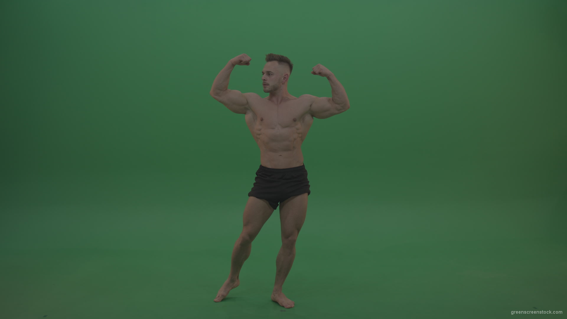 vj video background Young_Sportsman_Showing_Front_Double_Biceps_And_Thigh_Muscles_Bodybuilding_Positions_On_Gren_Screen_Wall_Background_003