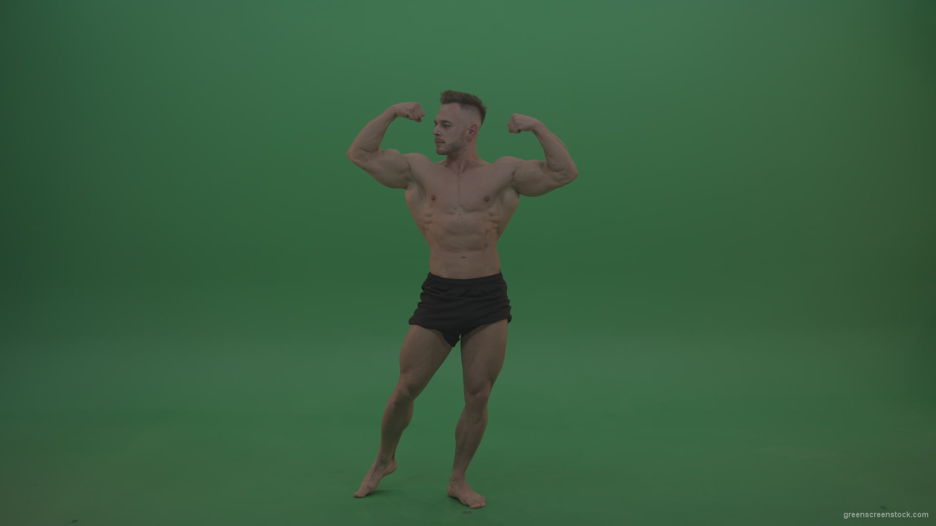 Young_Sportsman_Showing_Front_Double_Biceps_And_Thigh_Muscles_Bodybuilding_Positions_On_Gren_Screen_Wall_Background_004 Green Screen Stock