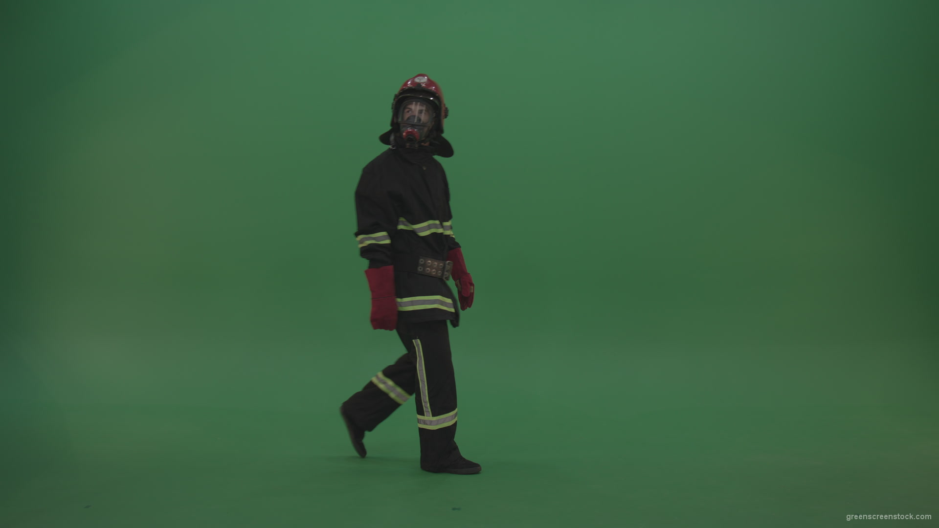 Young_Tough_Firefighter_Wearing_Fireman_Working_Kit_Costume_Walks_From_One_Side_To_Another_On_Green_Screen_Chroma_Key_Wall_Background_006 Green Screen Stock