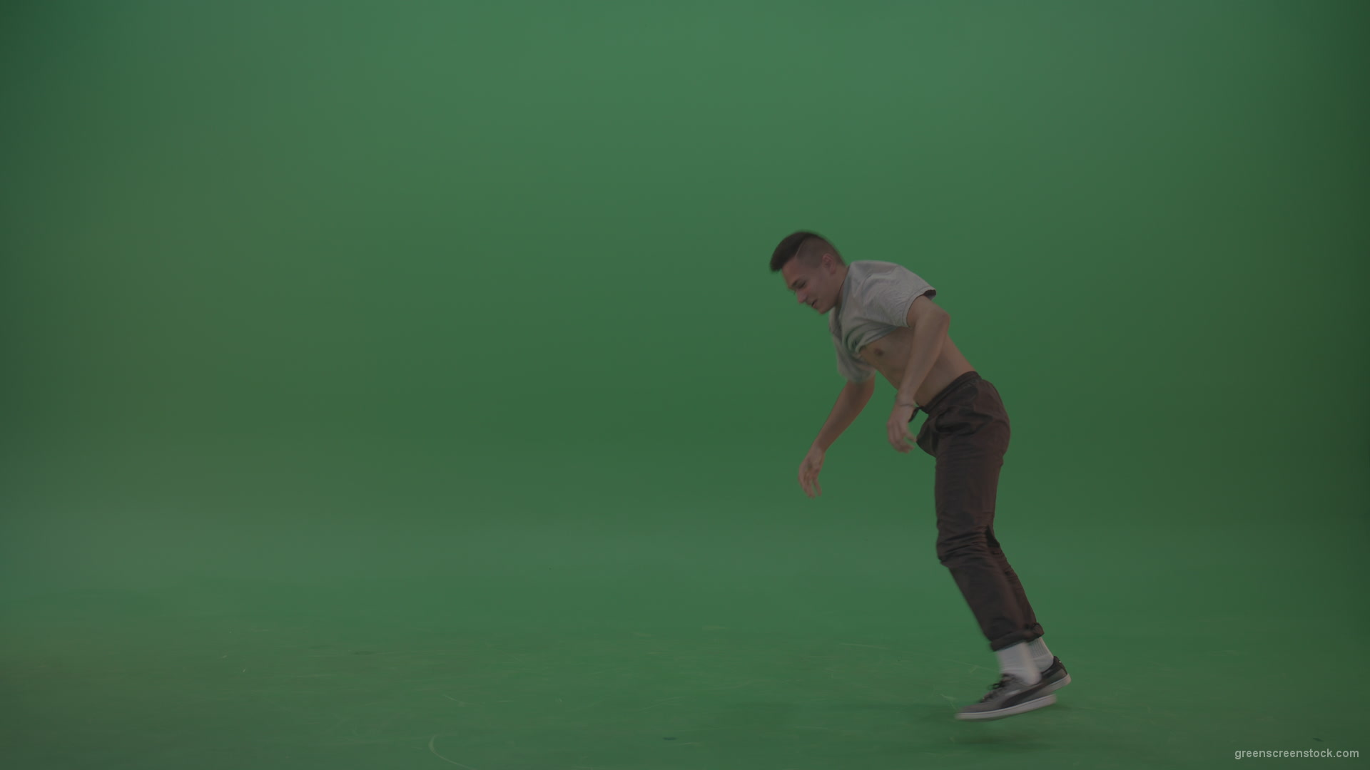 Man-dancing-and-staying-on-hand-on-the-green-floor-green-screen_009 Green Screen Stock
