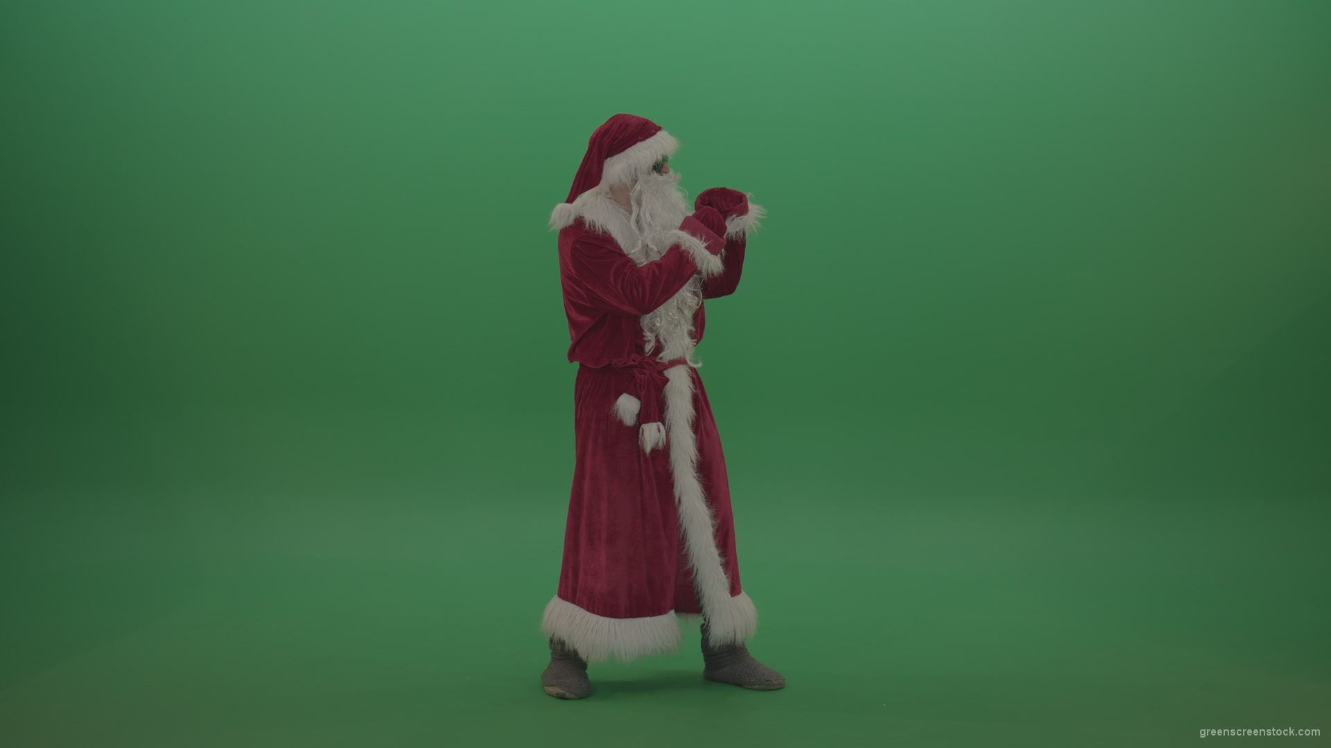 Santa-in-black-glasses-show-cases-his-boxing-skills-over-chromakey-background_001 Green Screen Stock