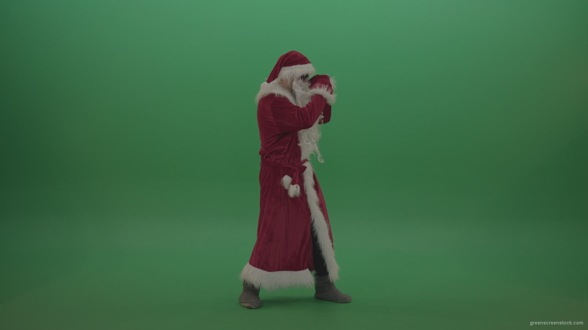 Santa-in-black-glasses-show-cases-his-boxing-skills-over-chromakey-background_002 Green Screen Stock