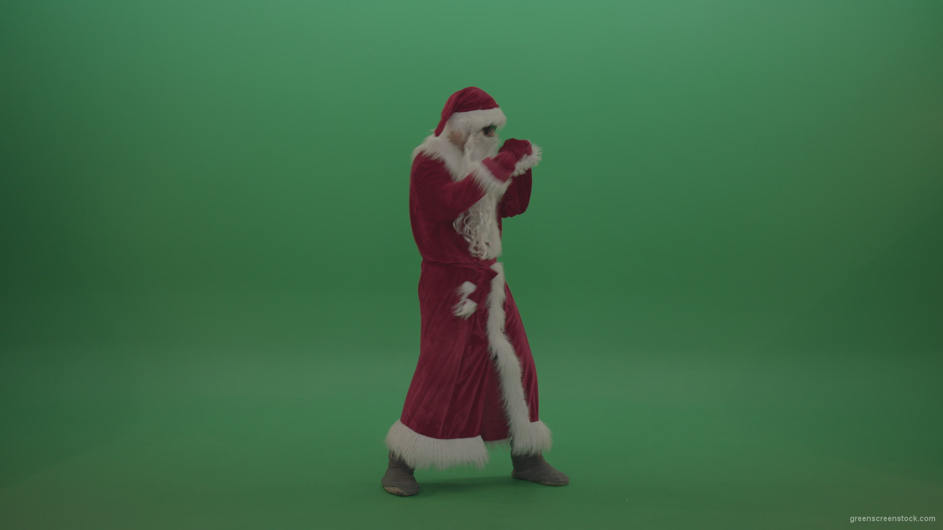 Santa-in-black-glasses-show-cases-his-boxing-skills-over-chromakey-background_004 Green Screen Stock