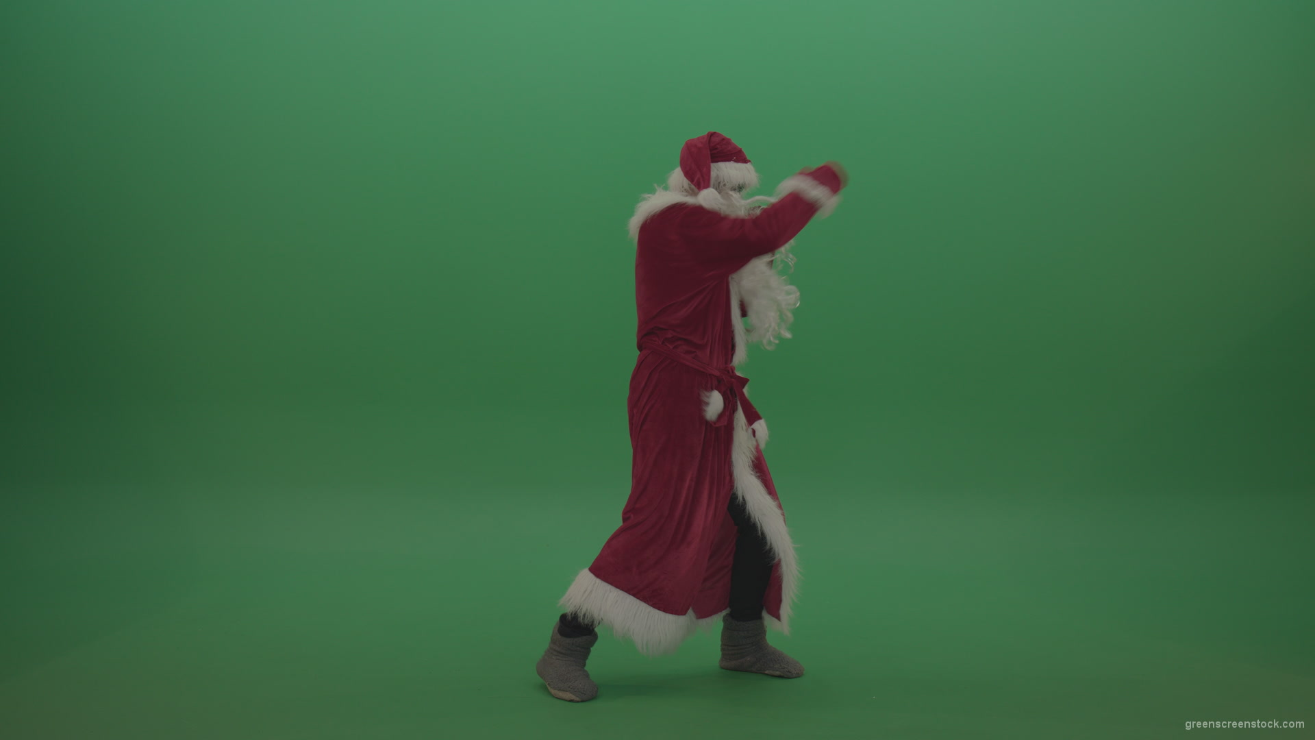 Santa-in-black-glasses-show-cases-his-boxing-skills-over-chromakey-background_006 Green Screen Stock