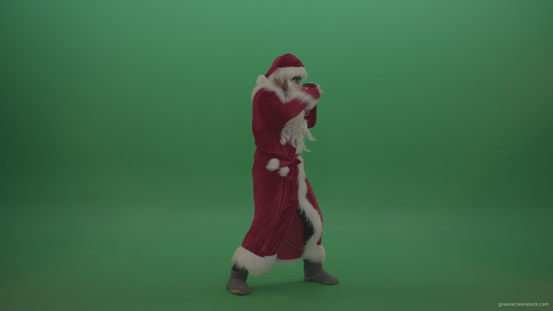 Santa-in-black-glasses-show-cases-his-boxing-skills-over-chromakey-background_007 Green Screen Stock