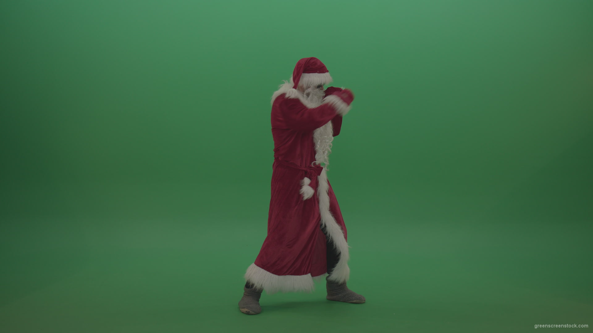 Santa-in-black-glasses-show-cases-his-boxing-skills-over-chromakey-background_008 Green Screen Stock