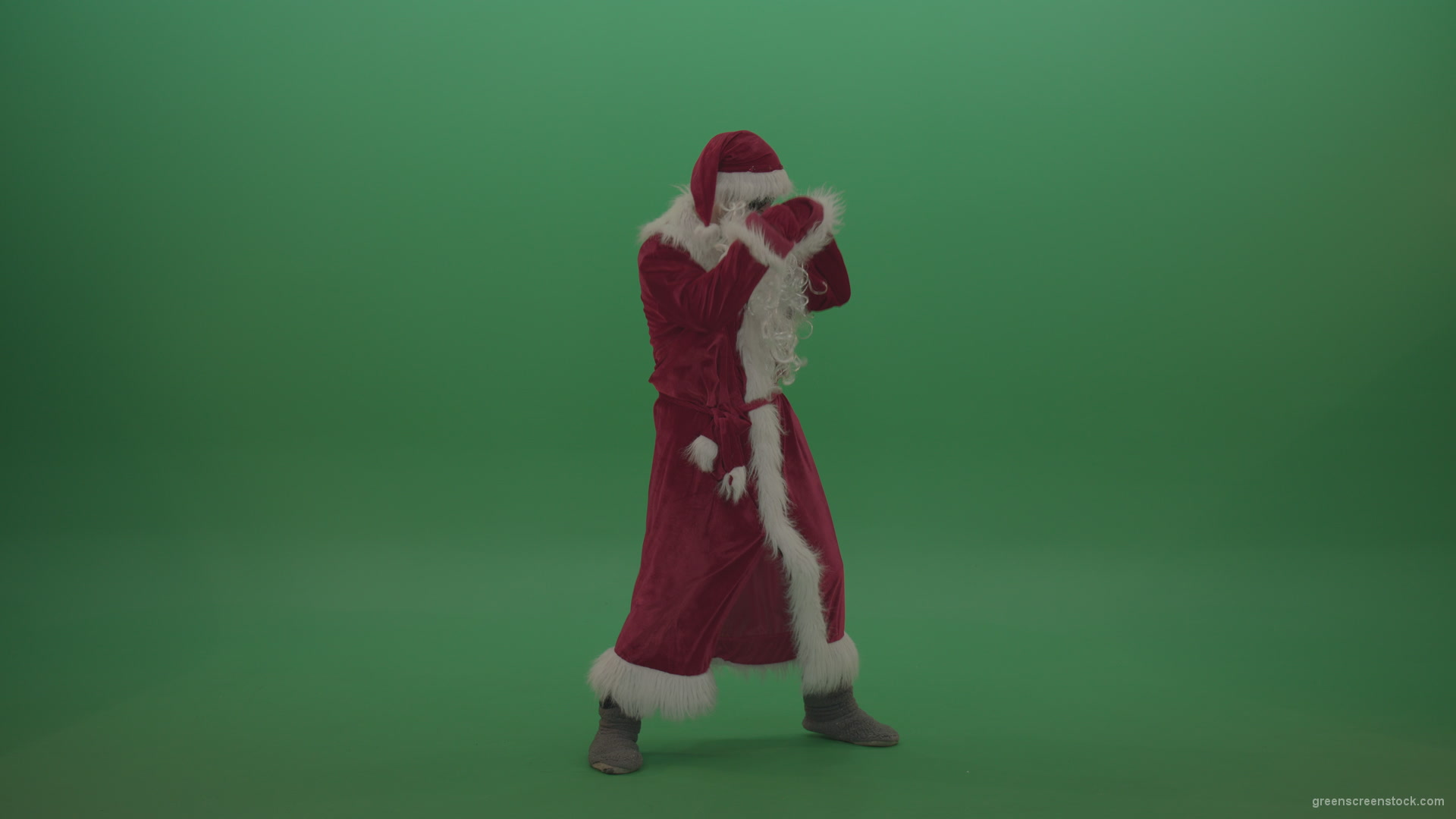 Santa-in-black-glasses-show-cases-his-boxing-skills-over-chromakey-background_009 Green Screen Stock