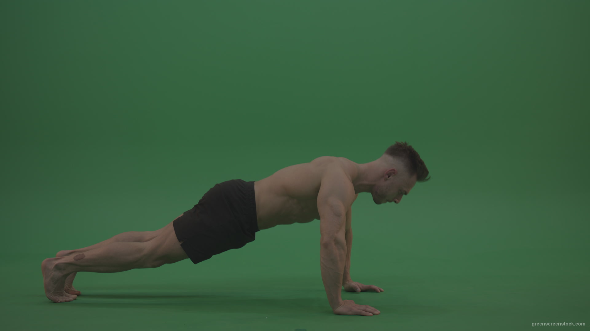 Young_Bodybuilder_Starts_Working_Out_From_Crouching_Terminator_Position_Does_Pull_Ups_Turns_Back_To_The_Start_Position_On_Green_Screen_Wall_Background_004 Green Screen Stock
