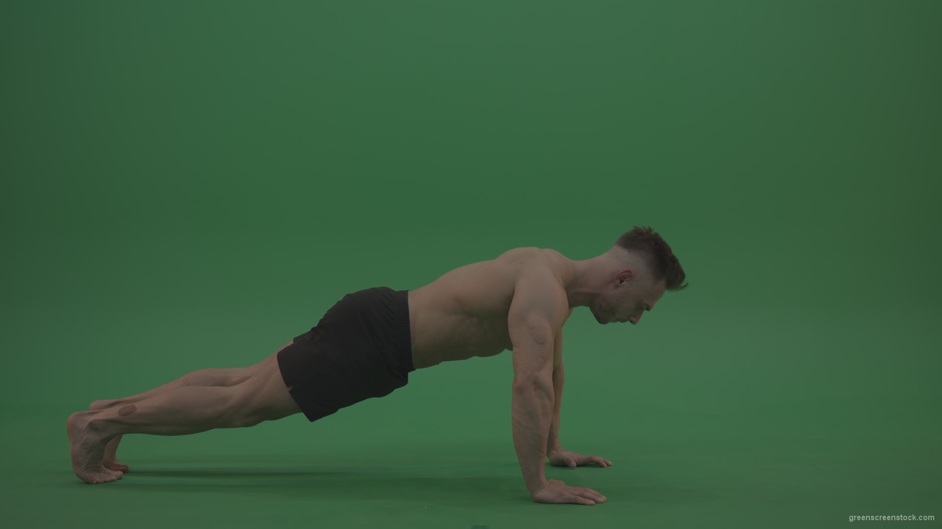 Young_Bodybuilder_Starts_Working_Out_From_Crouching_Terminator_Position_Does_Pull_Ups_Turns_Back_To_The_Start_Position_On_Green_Screen_Wall_Background_005 Green Screen Stock