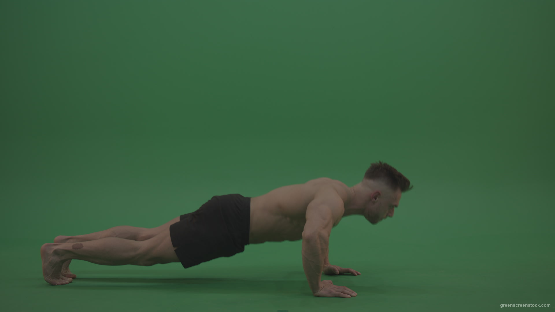 Young_Bodybuilder_Starts_Working_Out_From_Crouching_Terminator_Position_Does_Pull_Ups_Turns_Back_To_The_Start_Position_On_Green_Screen_Wall_Background_006 Green Screen Stock