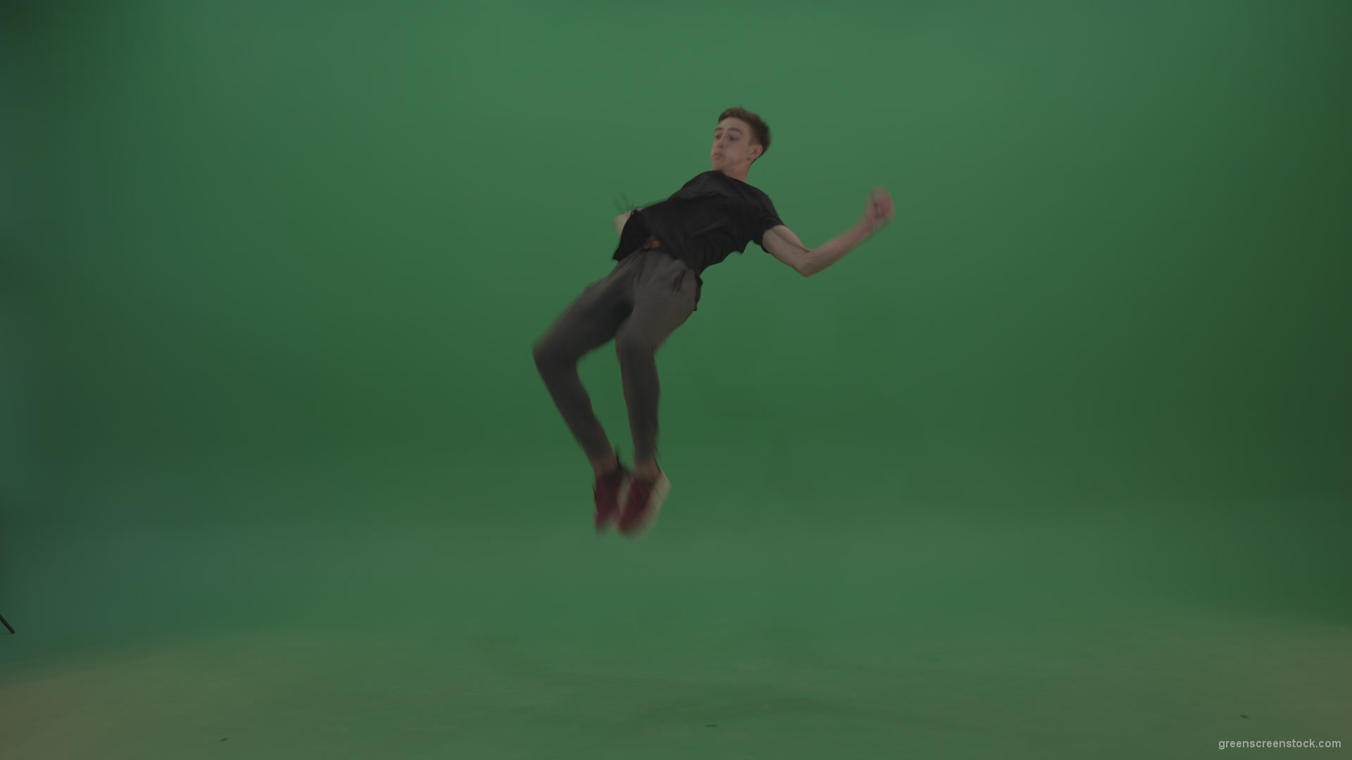 Young_Brunette_Boy_Wearing_Black_Clothes_Does_Perfect_Back_Flip_On_Green_Screen_Chroma_Key_Wall_Background_007 Green Screen Stock