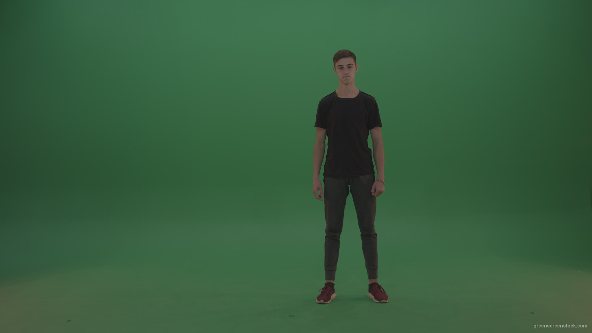 Young_Brunette_Sportsman_Wearing_Dark_Clothes_Doing_Side_Flip_On_Green_Screen_Wall_Background_001 Green Screen Stock