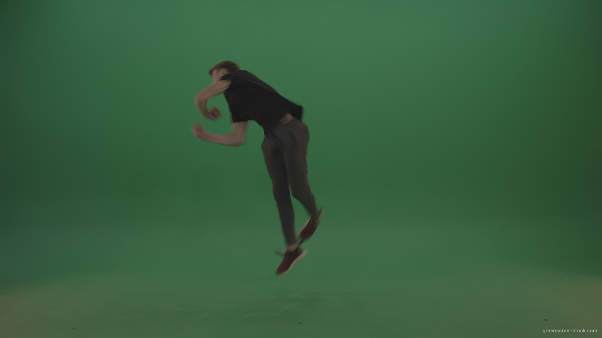 Young_Dark_Hair_Boy_Does_Perfect_Scoot_Back_360_Freerun_Parkour_Trick_On_Green_Screen_Wall_Background_007 Green Screen Stock