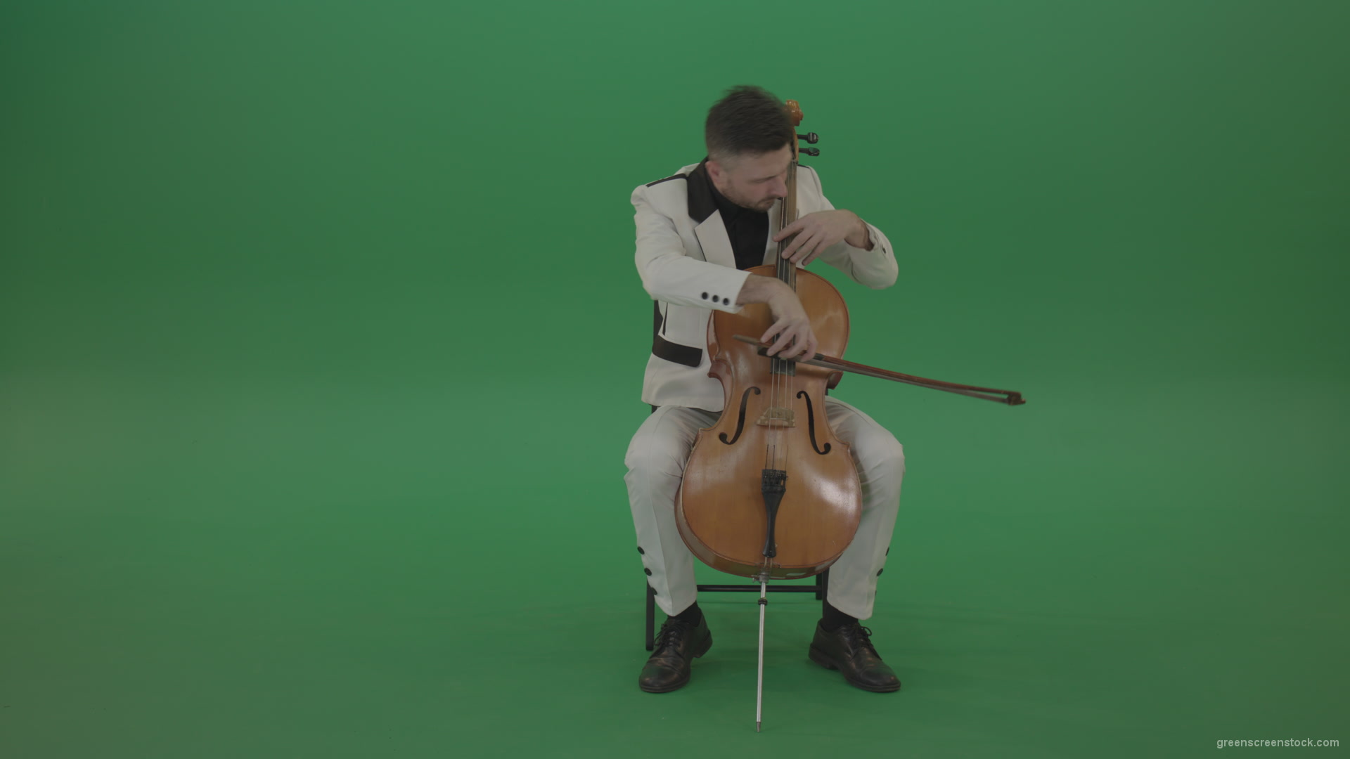 Classic-orchestra-man-in-white-wear-play-violoncello-cello-strings-music-instrument-isolated-on-green-screen_004 Green Screen Stock