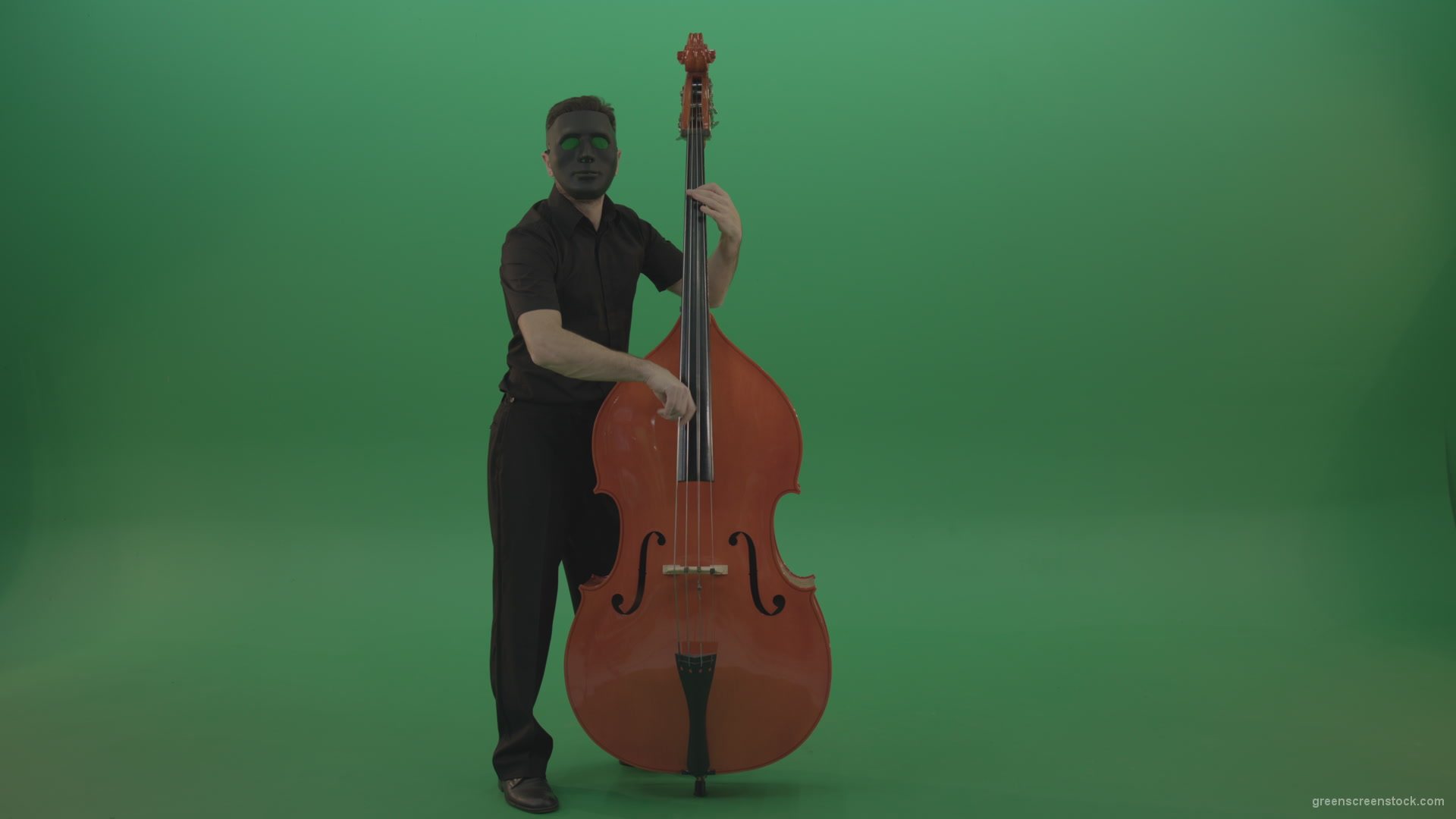 Full-size-man-in-black-gead-mask-with-chromakey-eyes-play-jazz-on-double-bass-String-music-instrument-isolated-on-green-screen_001 Green Screen Stock