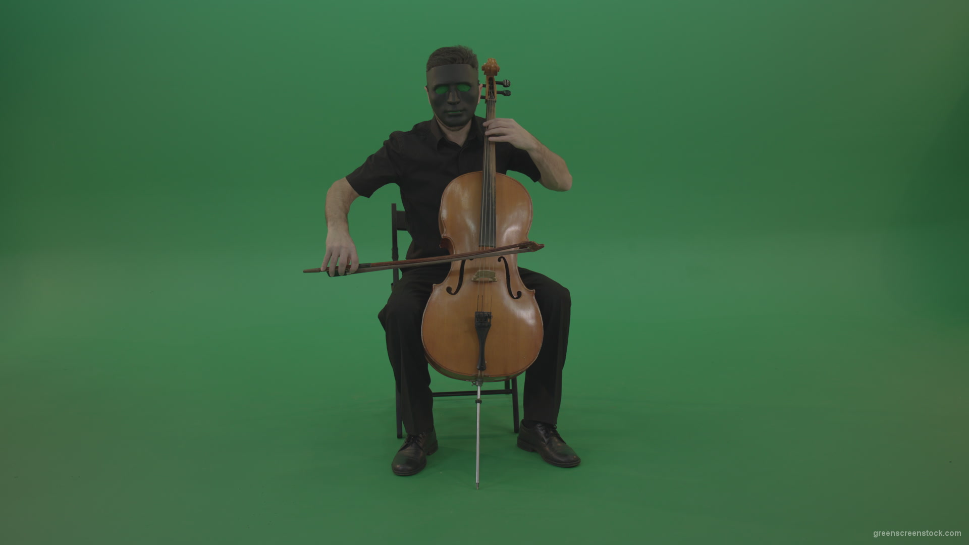 Full-size-man-in-black-wear-and-mask-play-violoncello-cello-strings-music-instrument-isolated-on-green-screen_001 Green Screen Stock