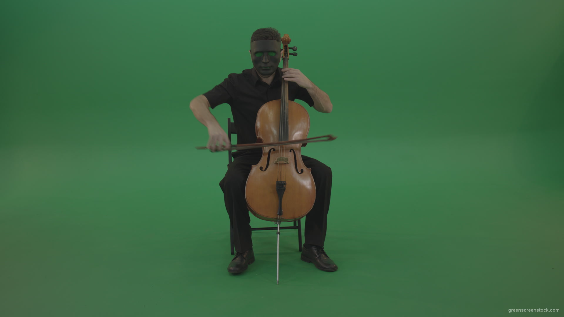 vj video background Full-size-man-in-black-wear-and-mask-play-violoncello-cello-strings-music-instrument-isolated-on-green-screen_003