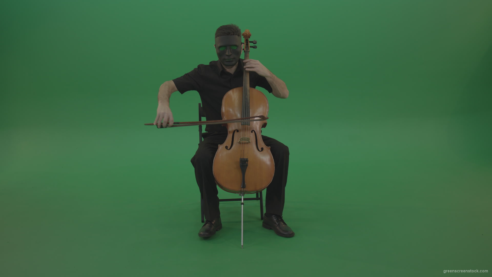 Full-size-man-in-black-wear-and-mask-play-violoncello-cello-strings-music-instrument-isolated-on-green-screen_004 Green Screen Stock