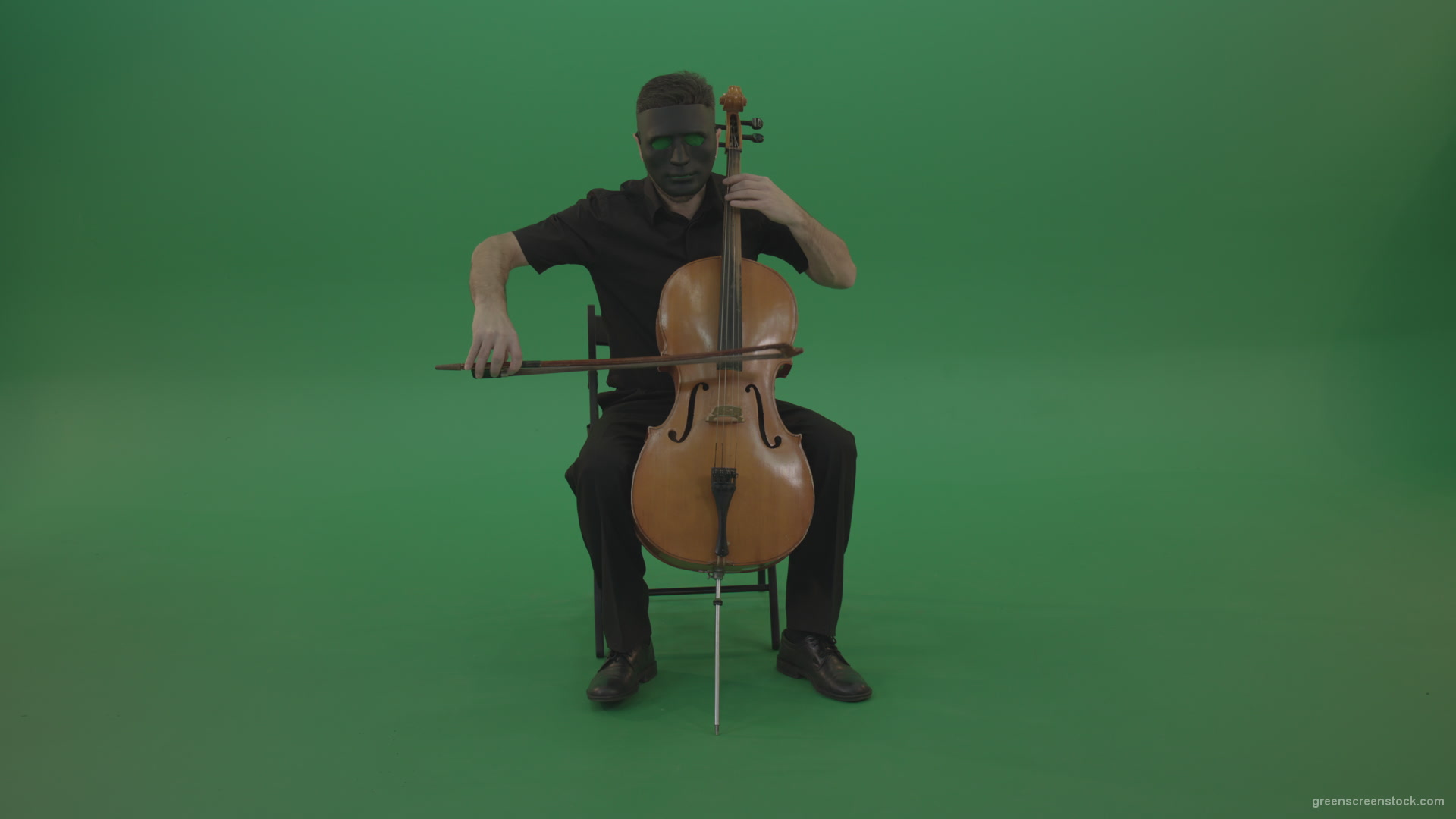 Full-size-man-in-black-wear-and-mask-play-violoncello-cello-strings-music-instrument-isolated-on-green-screen_005 Green Screen Stock