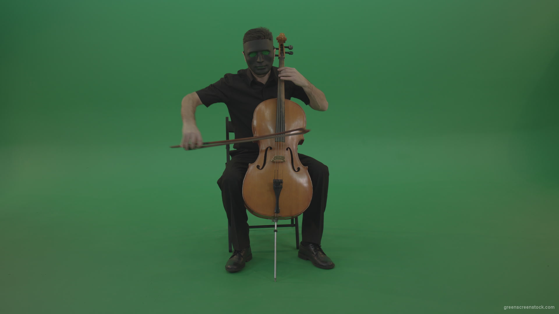 Full-size-man-in-black-wear-and-mask-play-violoncello-cello-strings-music-instrument-isolated-on-green-screen_006 Green Screen Stock