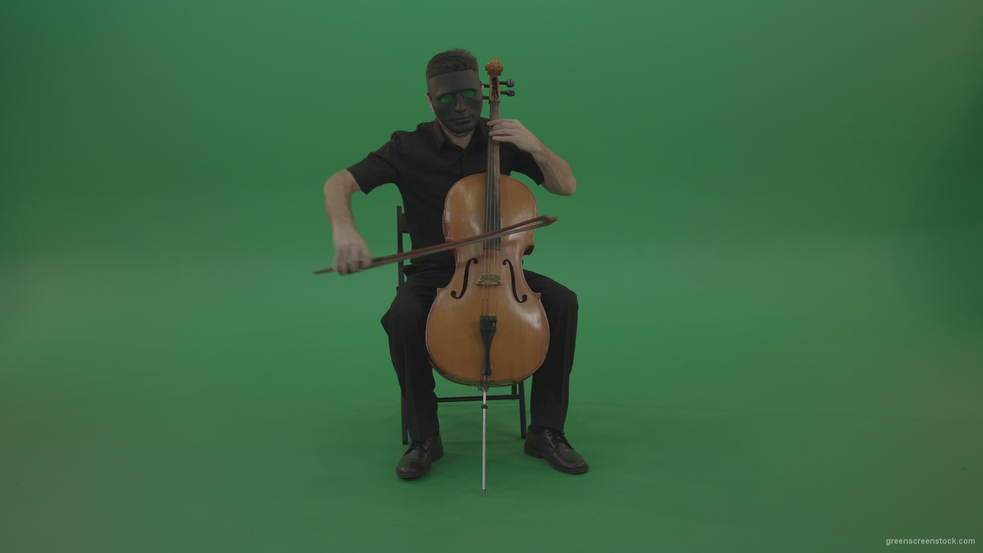 Full-size-man-in-black-wear-and-mask-play-violoncello-cello-strings-music-instrument-isolated-on-green-screen_007 Green Screen Stock