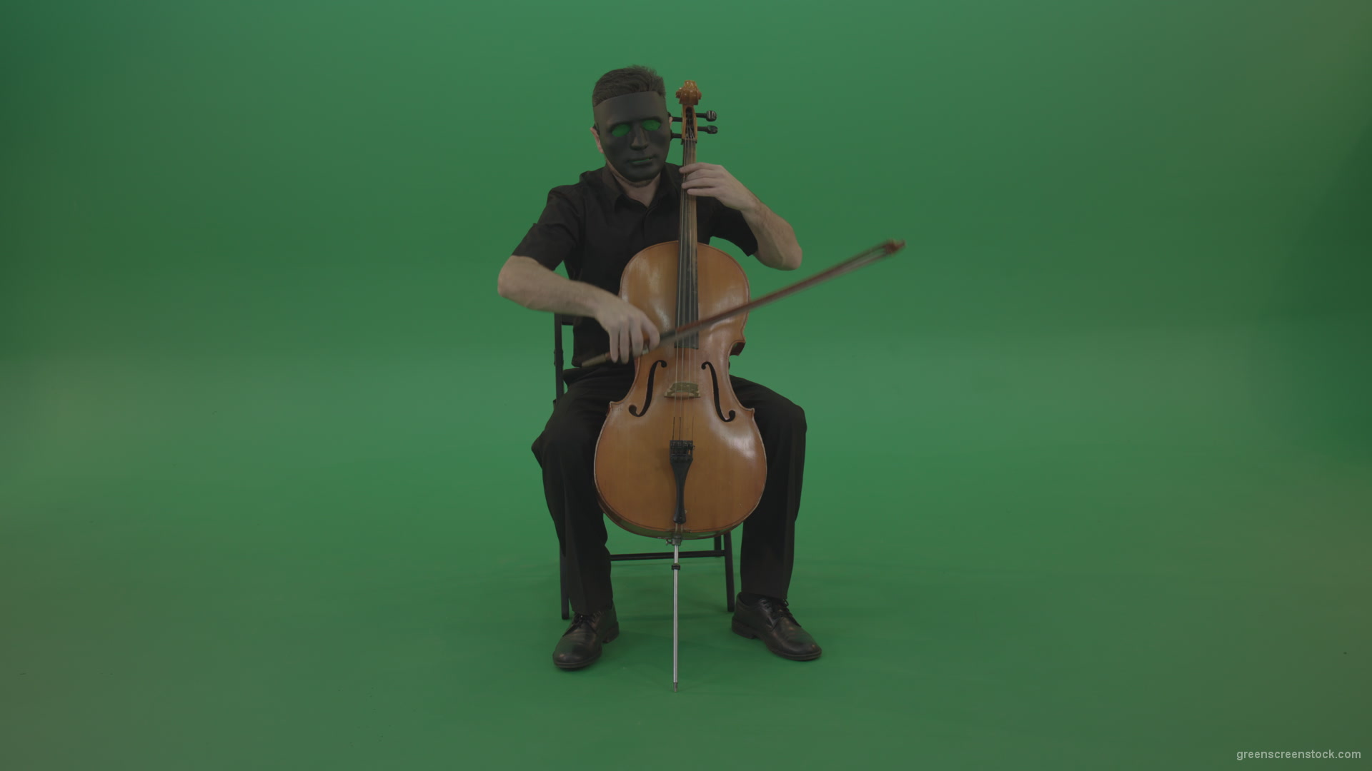 Full-size-man-in-black-wear-and-mask-play-violoncello-cello-strings-music-instrument-isolated-on-green-screen_009 Green Screen Stock