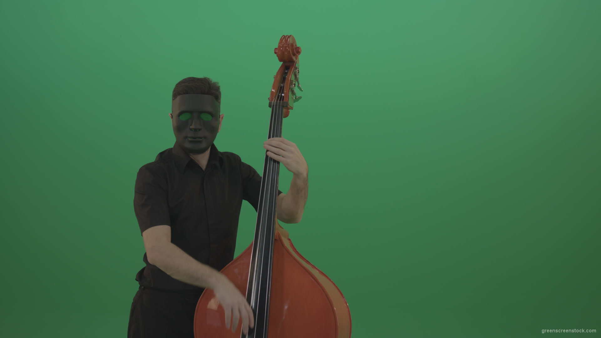 Man-in-black-mask-with-green-eyes-play-music-on-double-bass-instrument-isolated-on-green-screen_002 Green Screen Stock