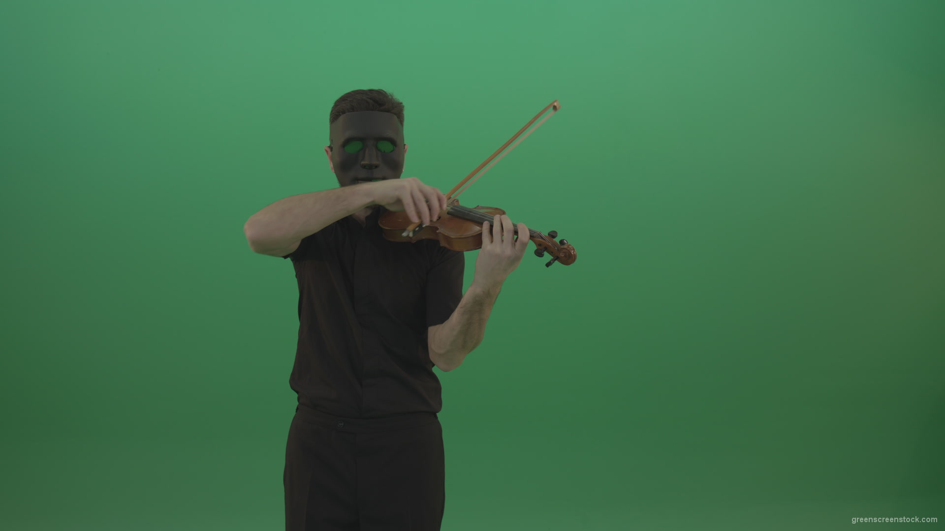 Man-in-black-shirt-and-mask-fast-play-violin-fiddle-strings-gothic-music-isolated-on-green-screen_002 Green Screen Stock