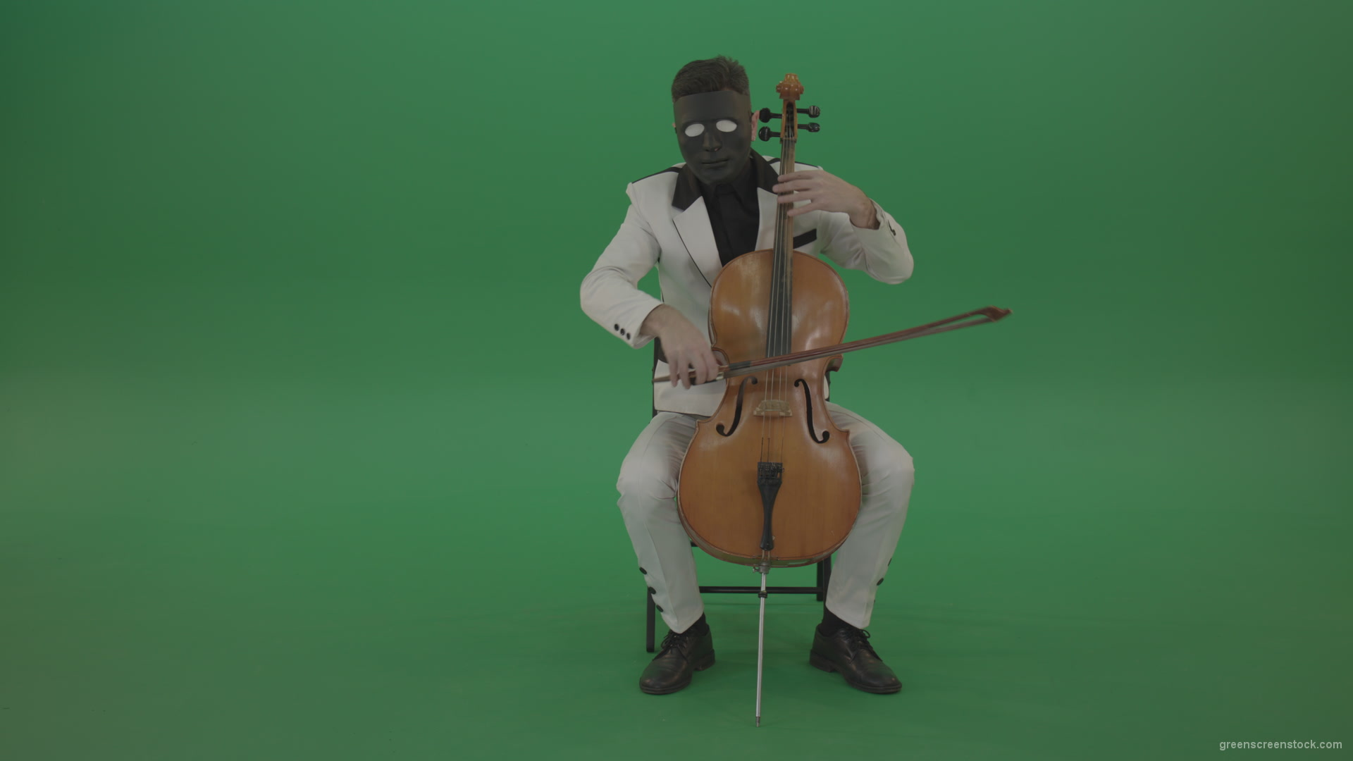 Man-plays-on-a-cello-in-a-white-suit-and-a-black-mask-with-white-eyes_002 Green Screen Stock