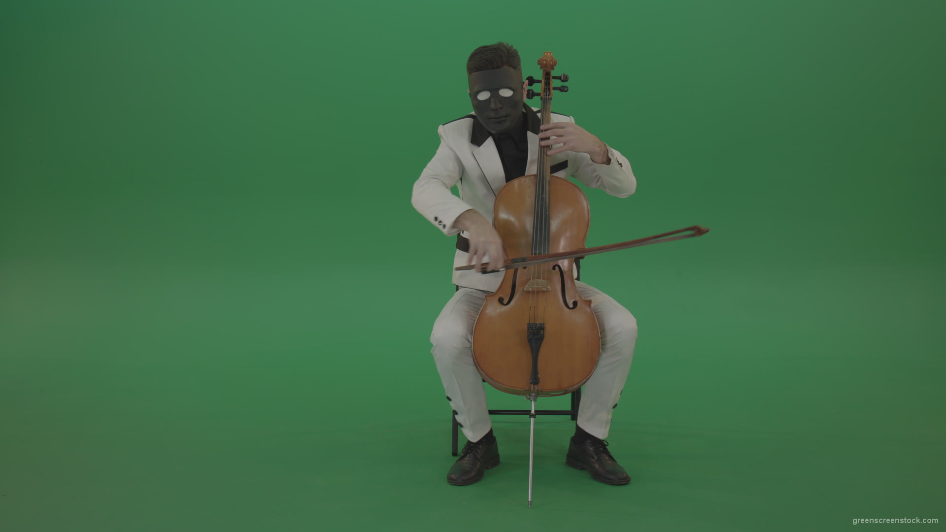 Man-plays-on-a-cello-in-a-white-suit-and-a-black-mask-with-white-eyes_004 Green Screen Stock