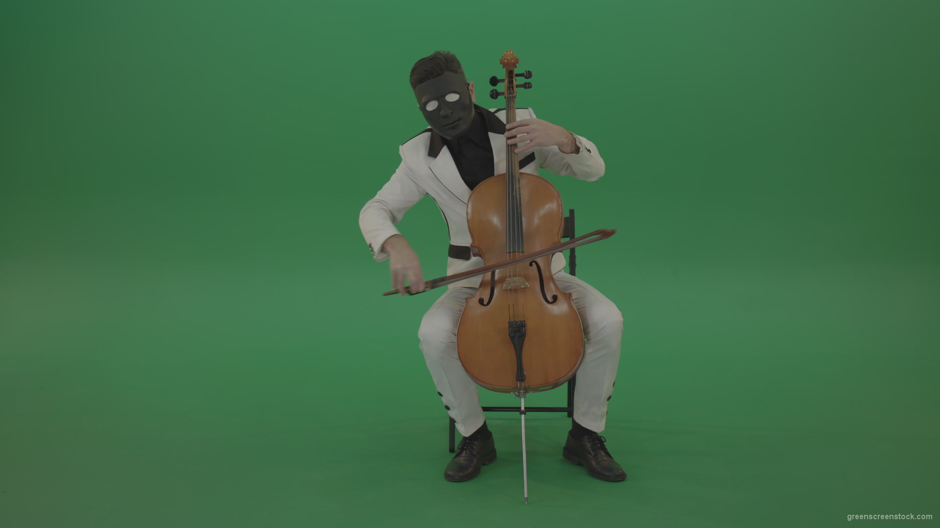 Man-plays-on-a-cello-in-a-white-suit-and-a-black-mask-with-white-eyes_005 Green Screen Stock