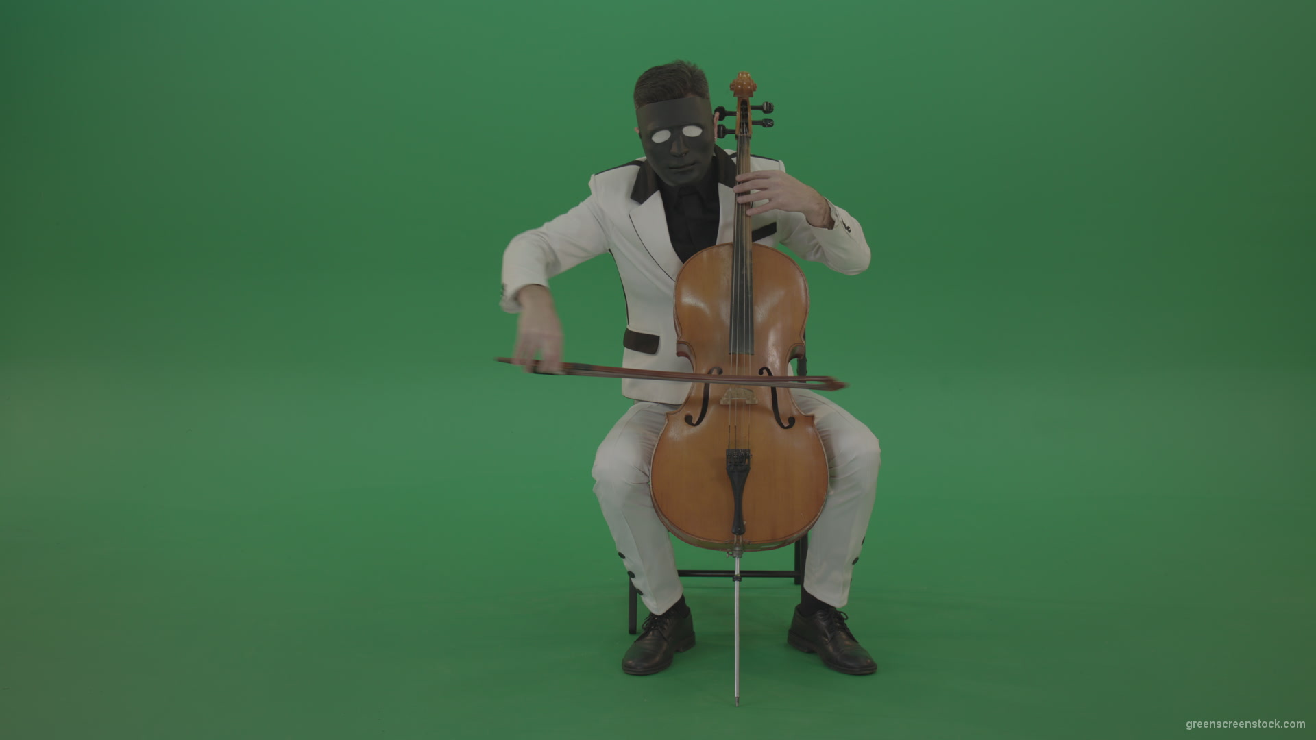 Man-plays-on-a-cello-in-a-white-suit-and-a-black-mask-with-white-eyes_006 Green Screen Stock