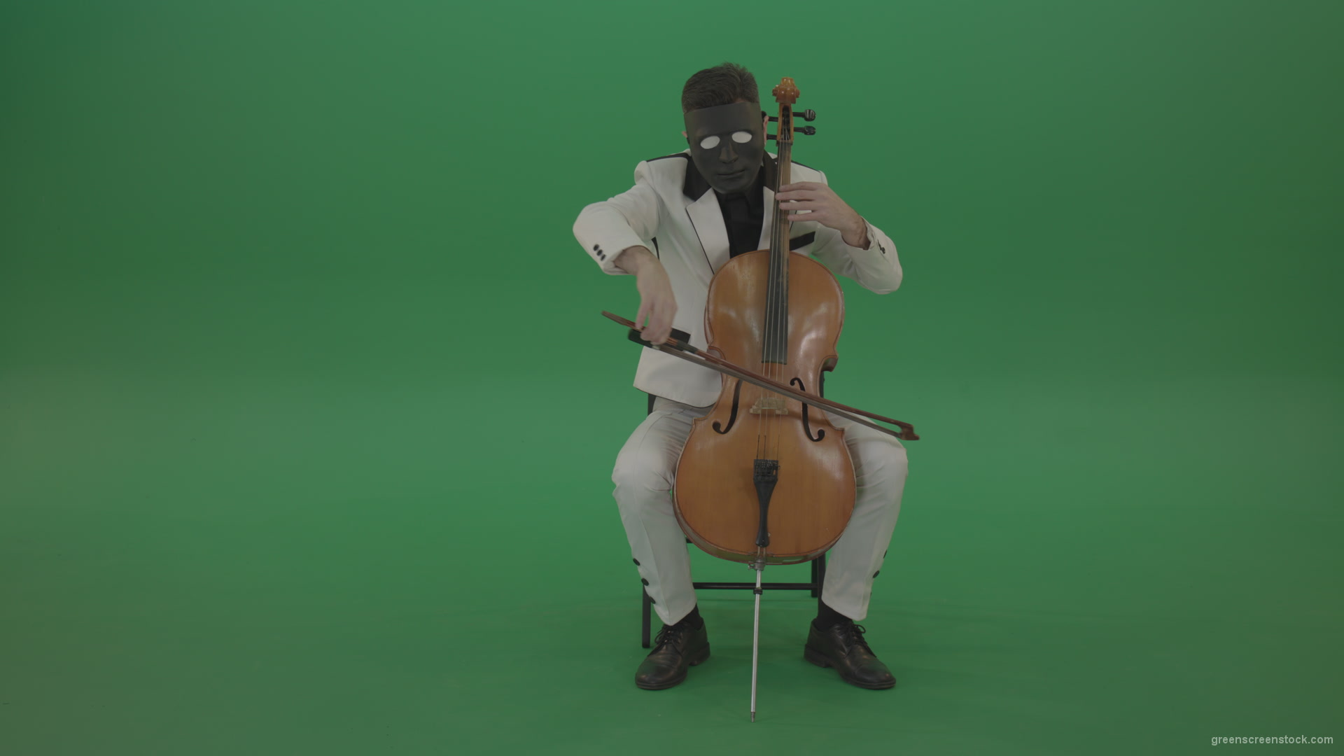 Man-plays-on-a-cello-in-a-white-suit-and-a-black-mask-with-white-eyes_007 Green Screen Stock