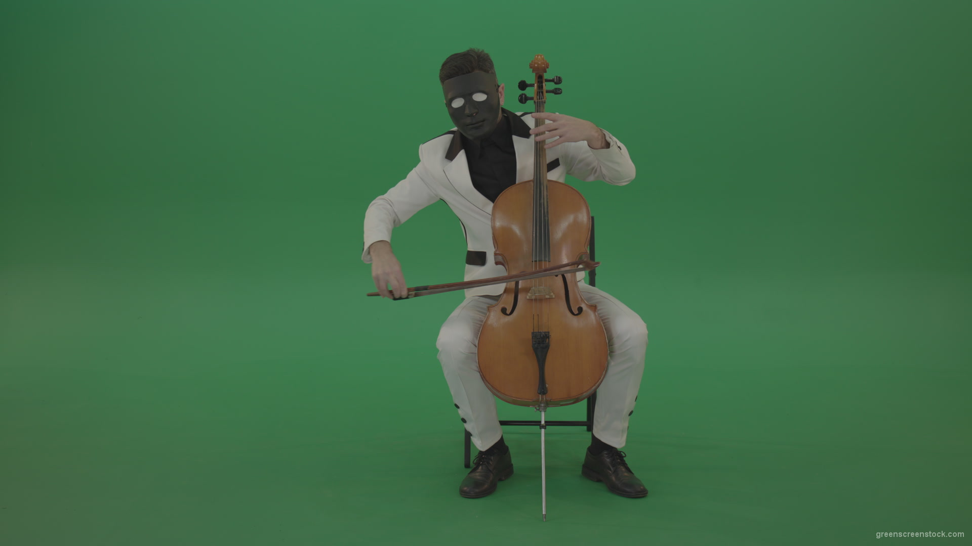 Man-plays-on-a-cello-in-a-white-suit-and-a-black-mask-with-white-eyes_009 Green Screen Stock