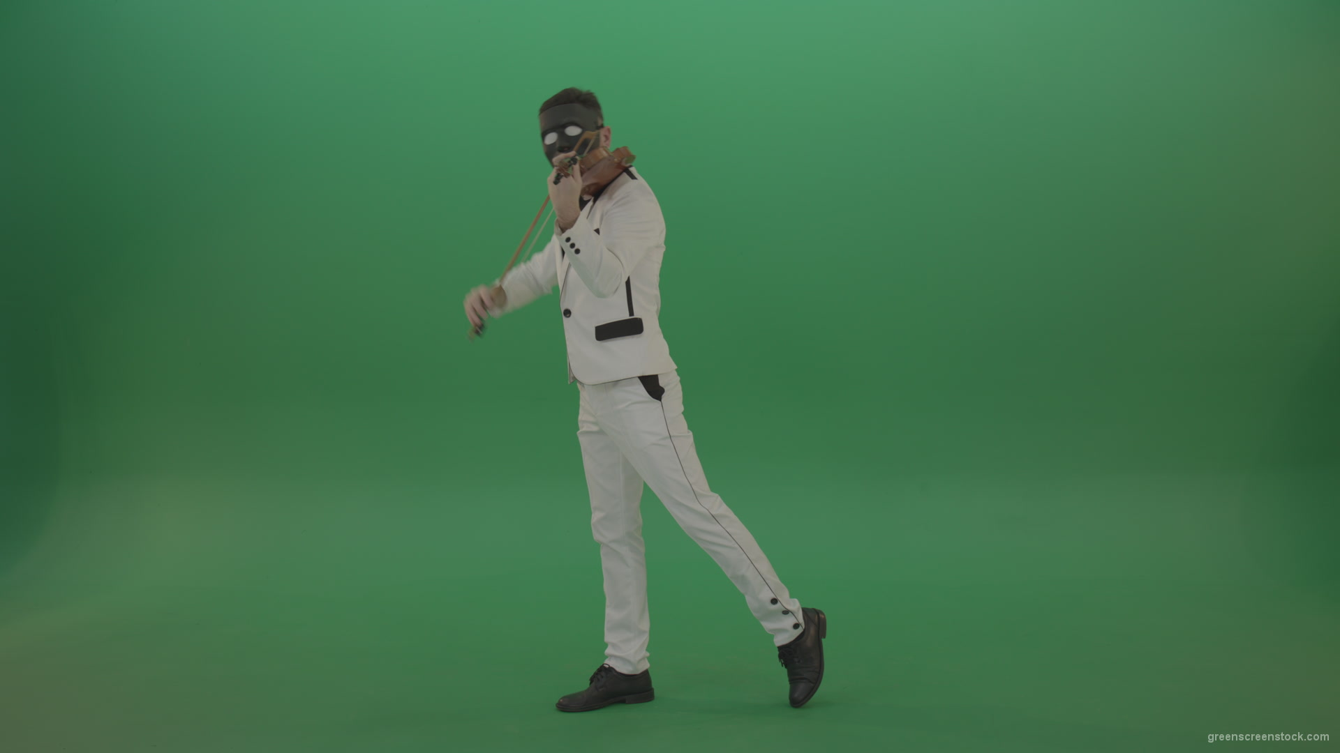 Violinist-in-a-white-jacket-and-in-a-black-mask-with-white-eyes-plays-melodically-on-the-violin_004 Green Screen Stock